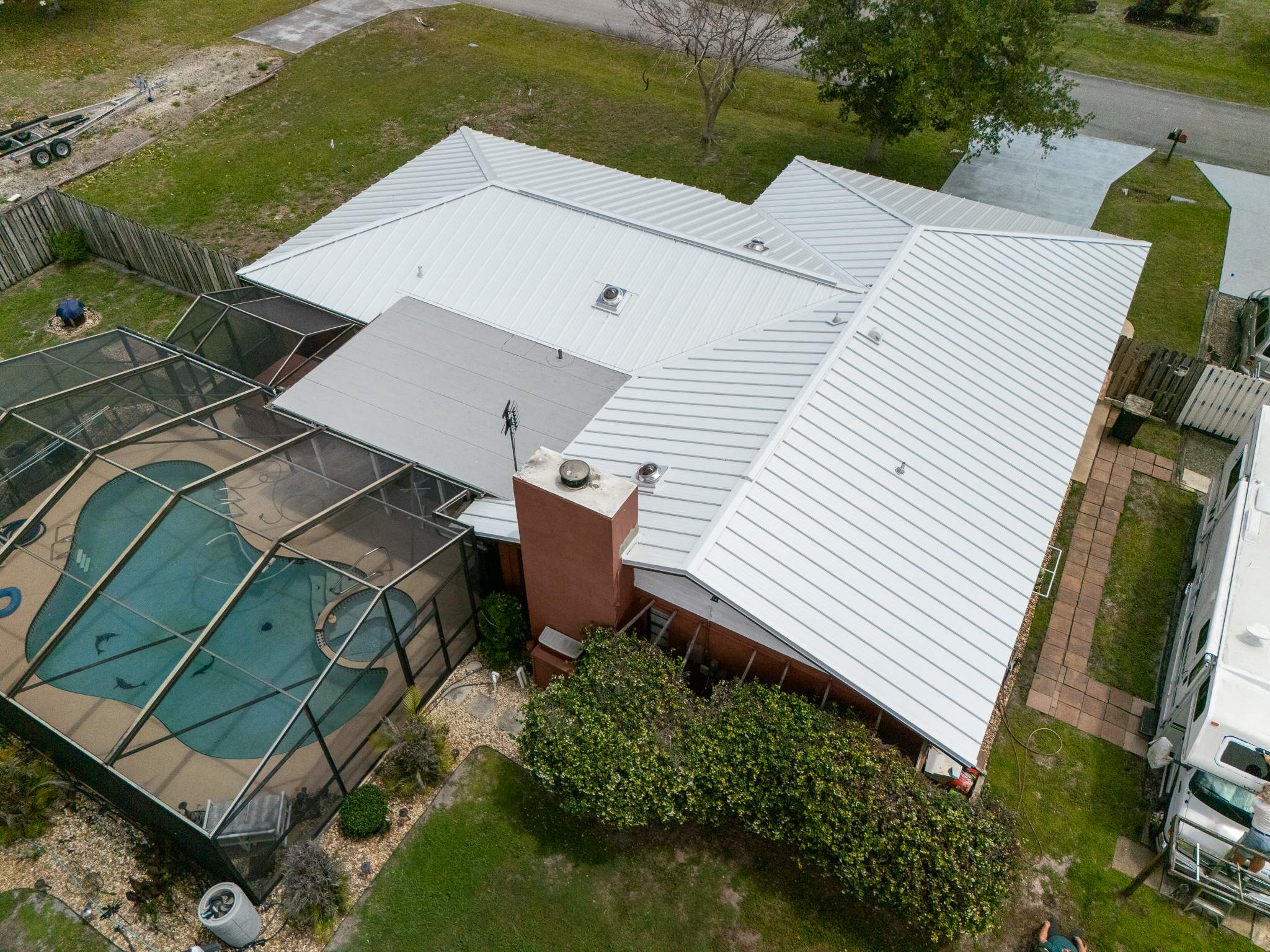 White Standing Seam Metal Roof Replacement and Hurricane Reinforcement in Palm Bay, Florida by Wiedmann Construction & Roofing