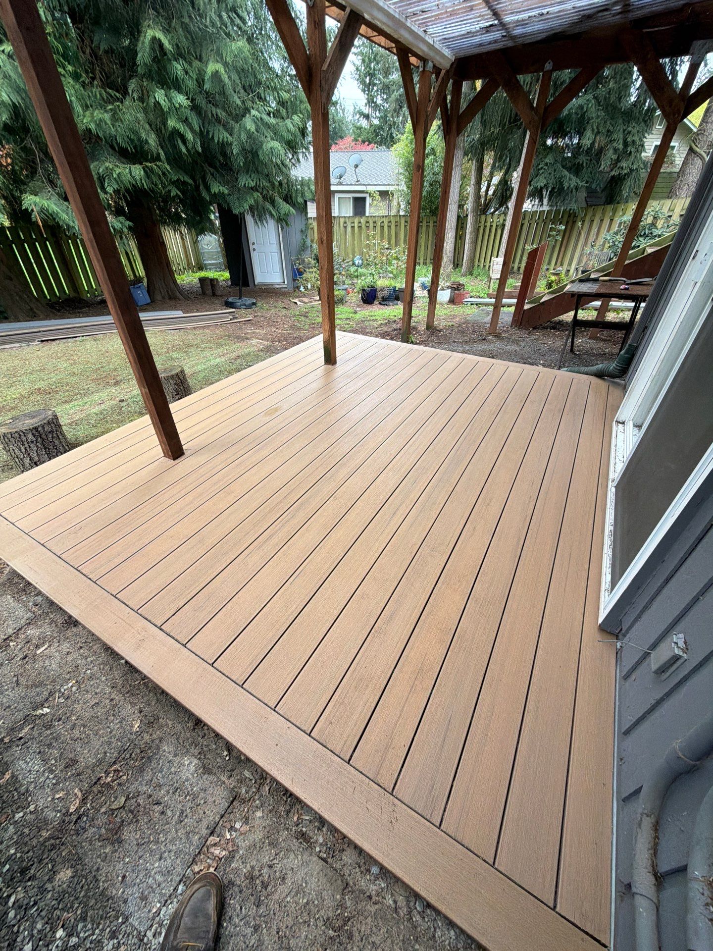 Elevated TimberTech Composite Deck Replacement With Black Metal Railings by Emerald City Energy