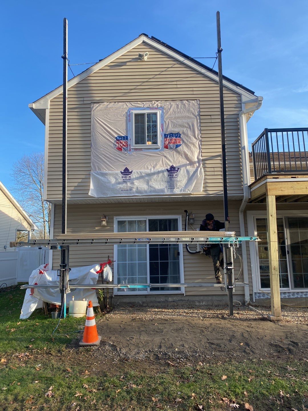 Siding Repair using Certainteed Mainsteet D4 and EPDM roof under deck by A Plus Exterior