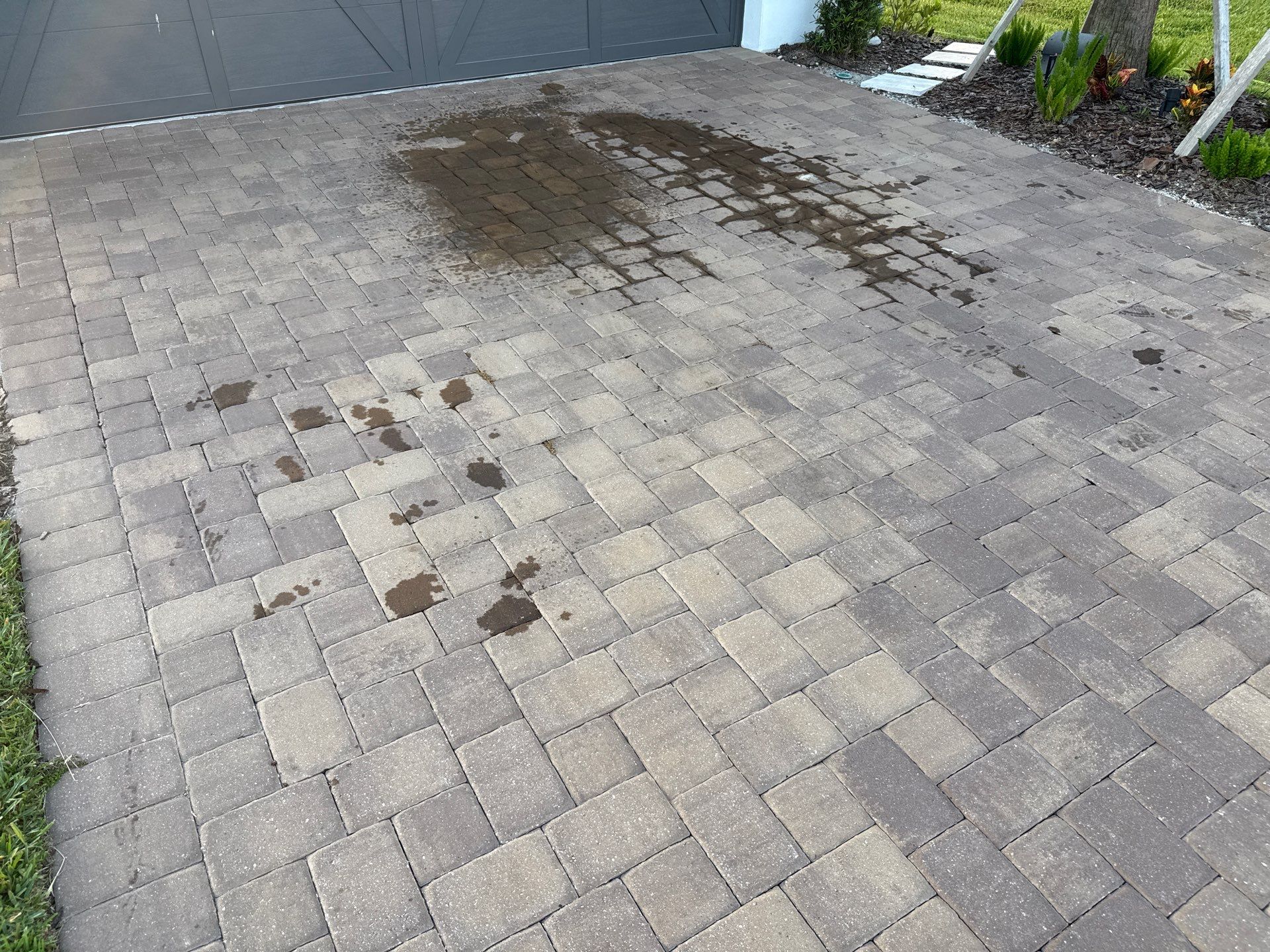 Oil Stain Removal on Paver Driveway | Esplanade at Artisan Lakes, Palmetto FL by Sunshine AquaWash