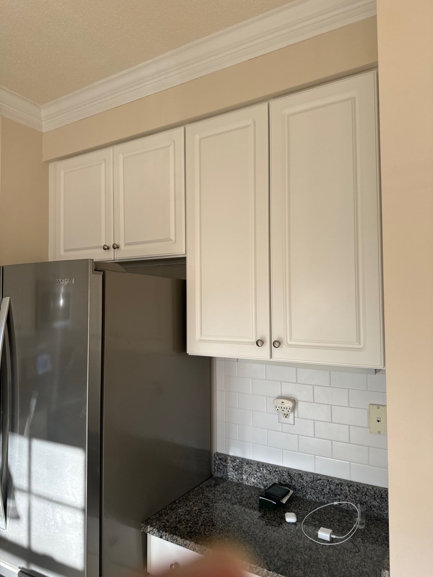 Cabinet painting by GonzalezPainters & Contractors Inc 