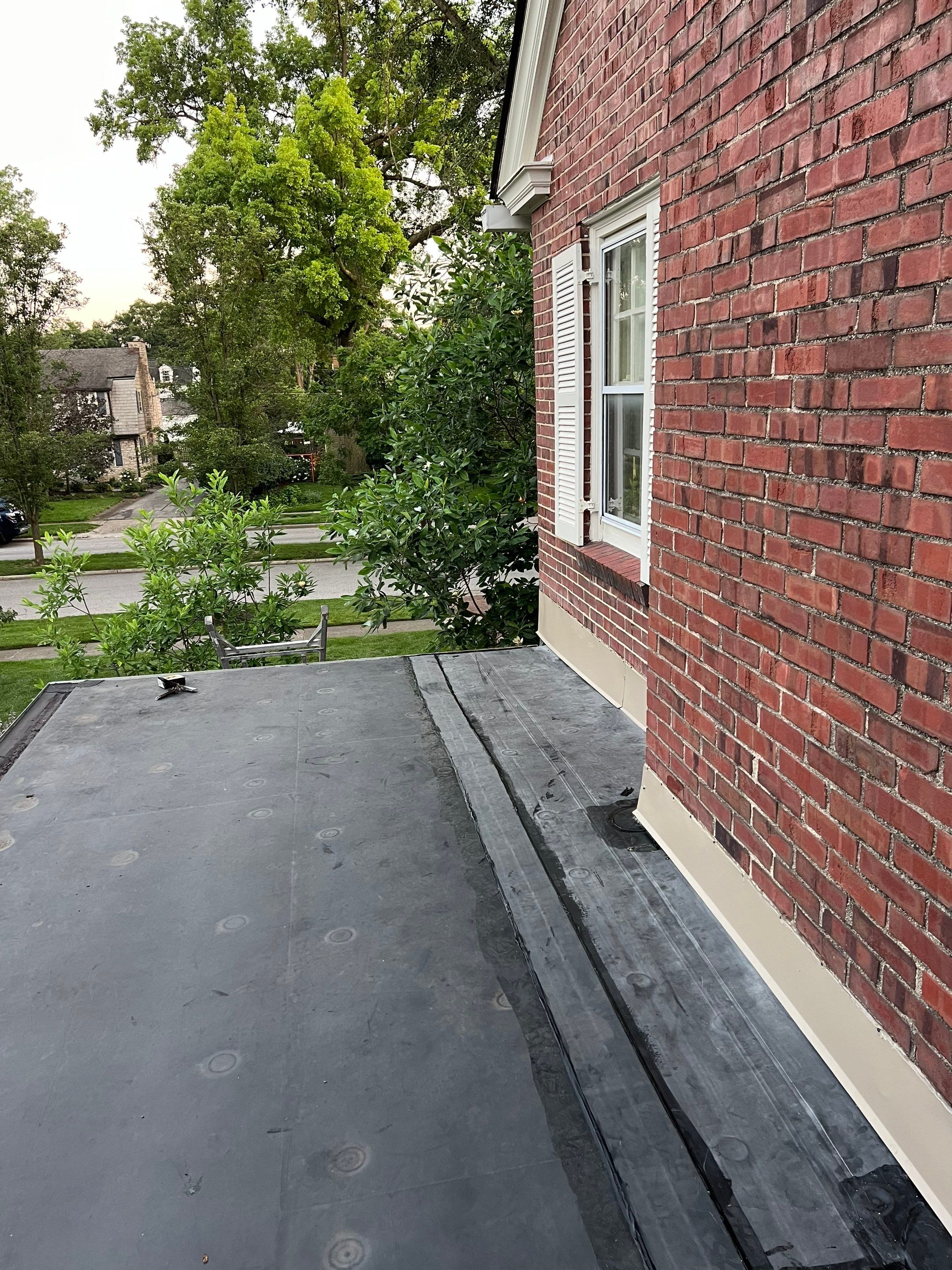 Residential Roofing Installation using 60 mil rubber roof  by Nitro Roofing and Construction