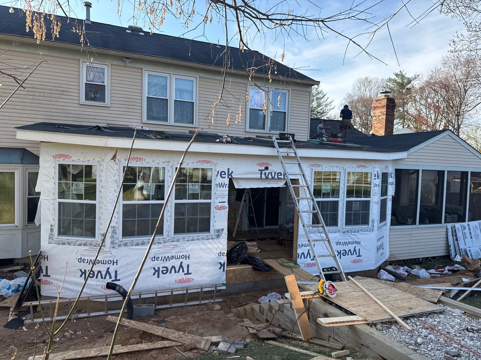 Sun room  using Concrete wood lumber, insulation , drywall, painting , cabinets , laminate floor  . by Jesus Master Handyman LLC 
