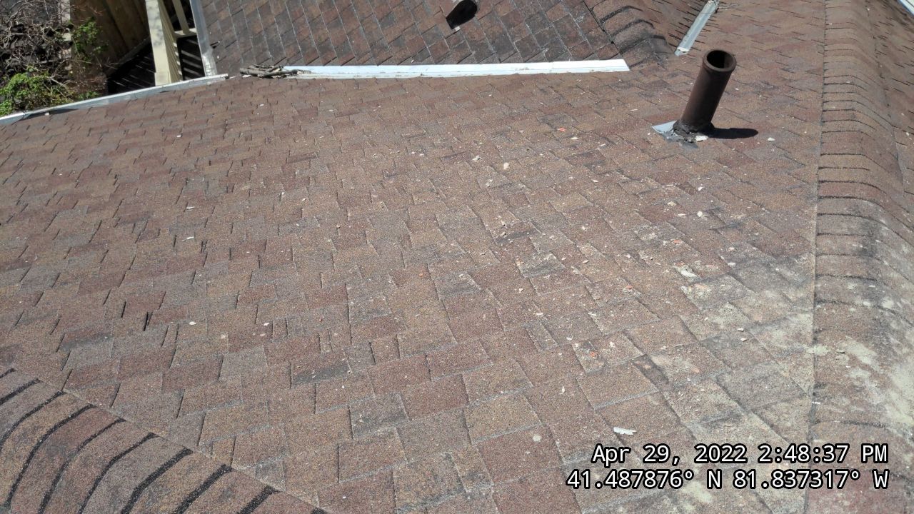 Residential Roofing Installation, Dec-tek walk-out porch roof, siding on garage by Absolute Roofing and Construction