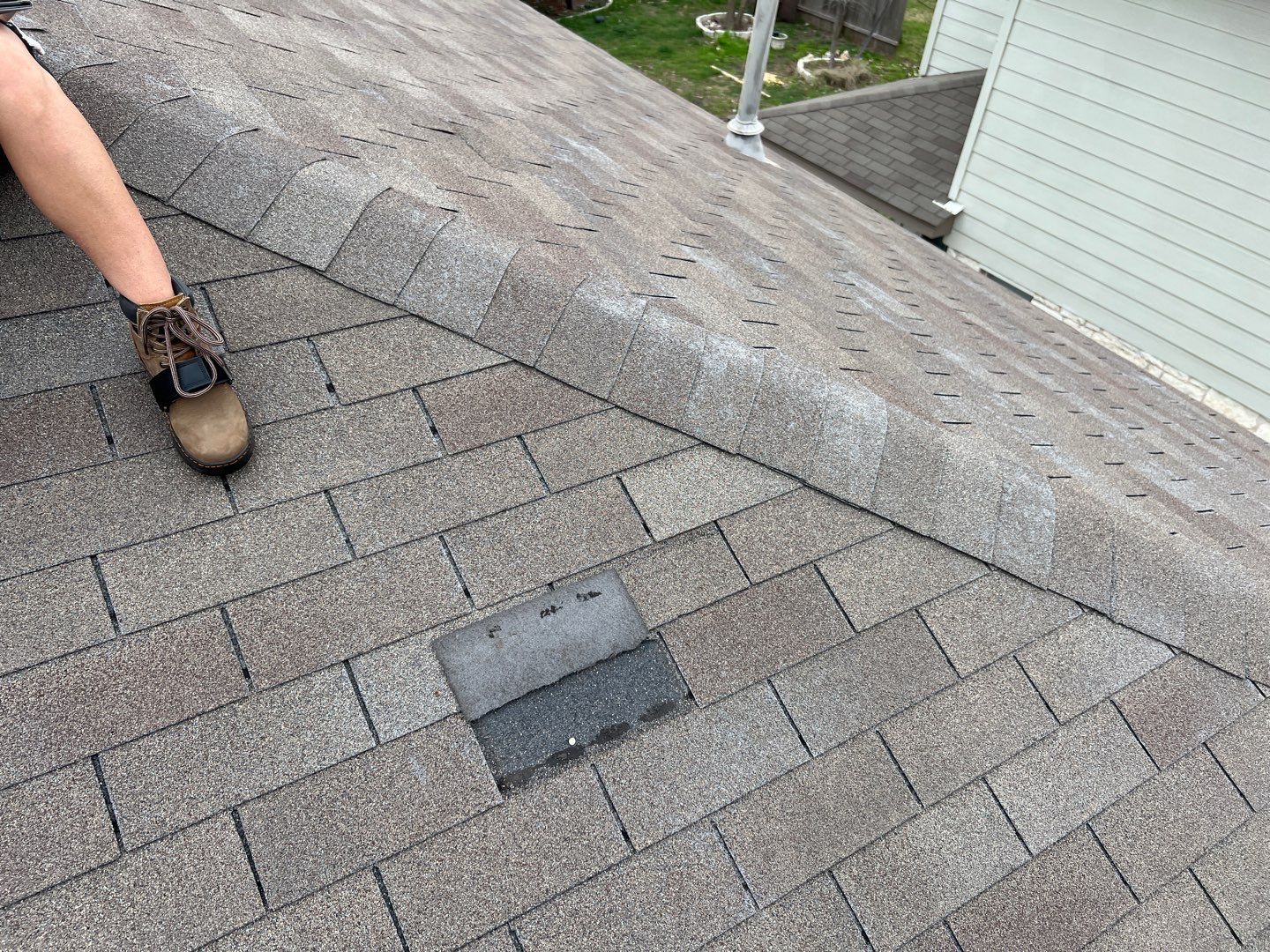 Wind damaged roof replacement by Oakwood Roofing and Construction, LLC