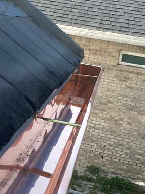 Seamless Gutter Installation Using Copper K- Style Gutters