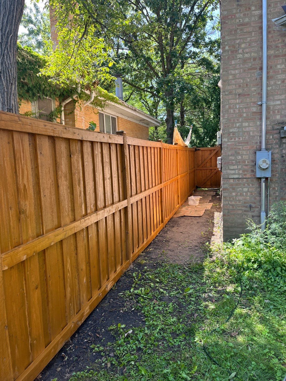Wood fence cleaning and sealing by Northern Power Washing LLC.