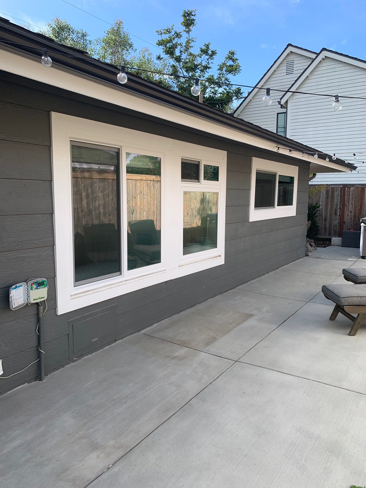Window Installation using Milgard black vinyl windows by American Window Company