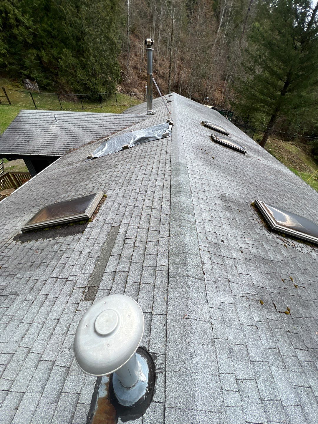 Residential ReRoofing Installation using 12" Prolok metal by Top Notch Roofing Inc