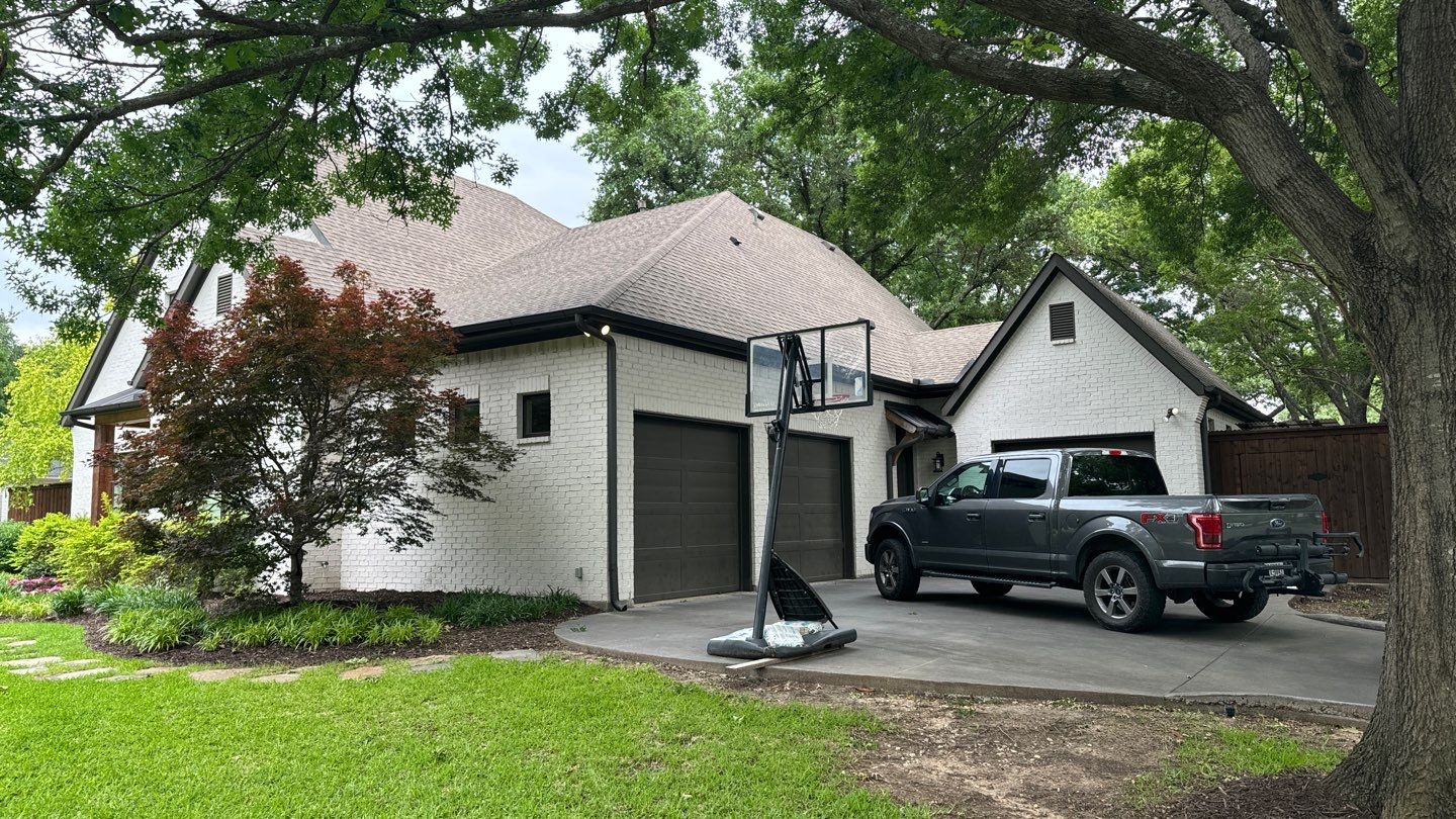 White brick with GAF Weathered Wood by Tejas Roofworks + Restoration