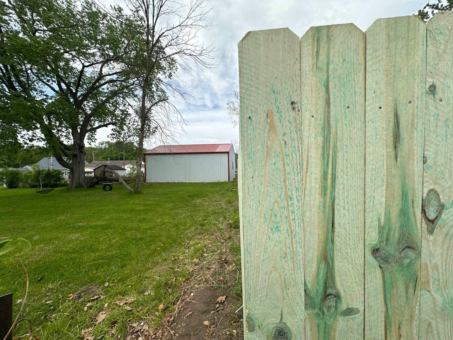 Pressure-Treated Wood Privacy Fence Installation in Waterloo by Perfect Picket Fence and Stain