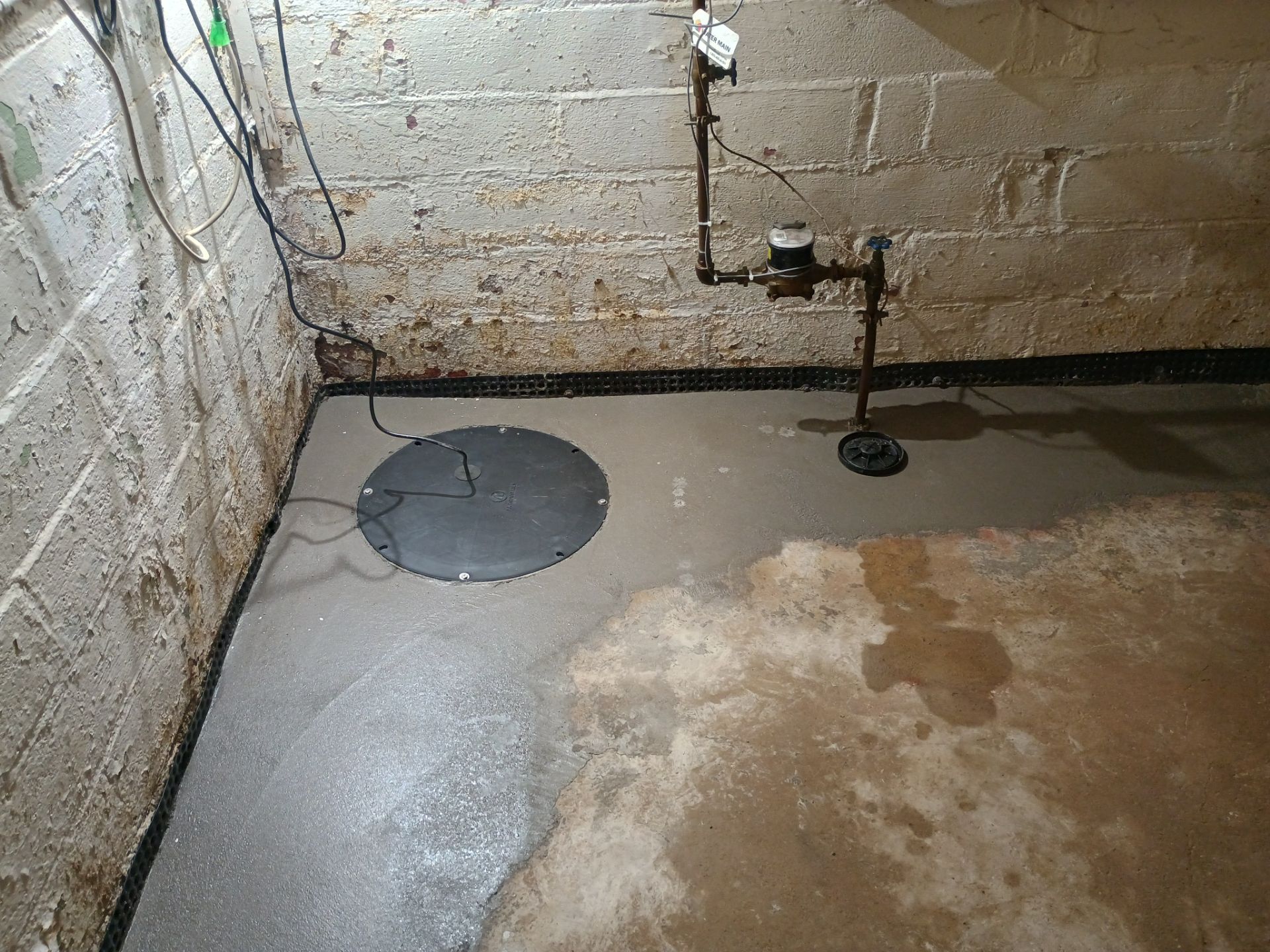 Interior Drain Tile & Sump Pump System in North Minneapolis by Waterproofing Northeast