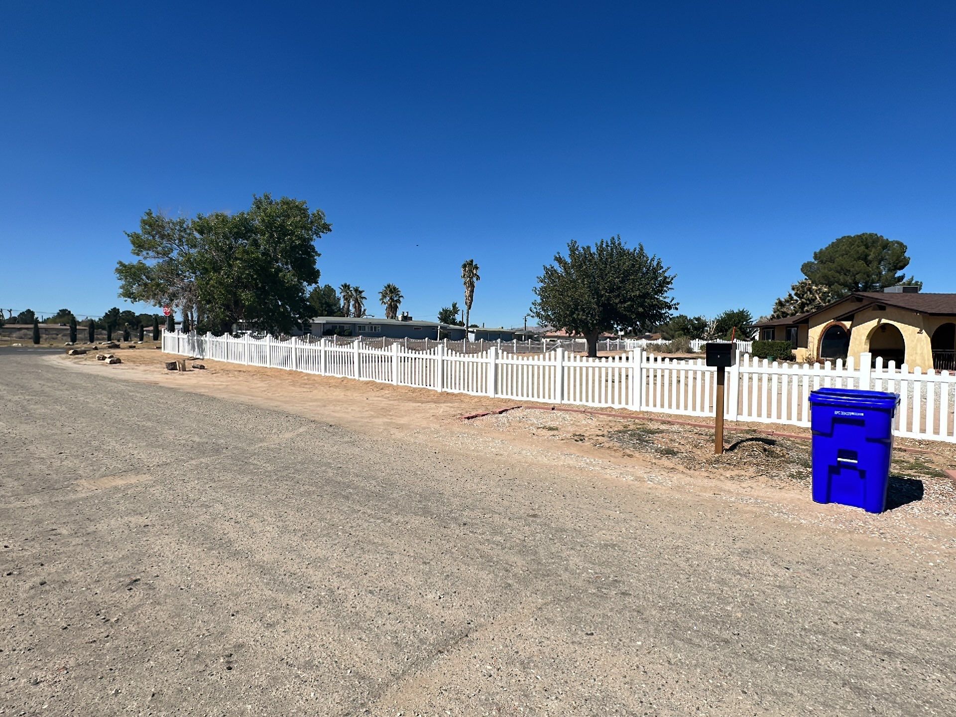 White picket fence  by Fence Guys Inc. 