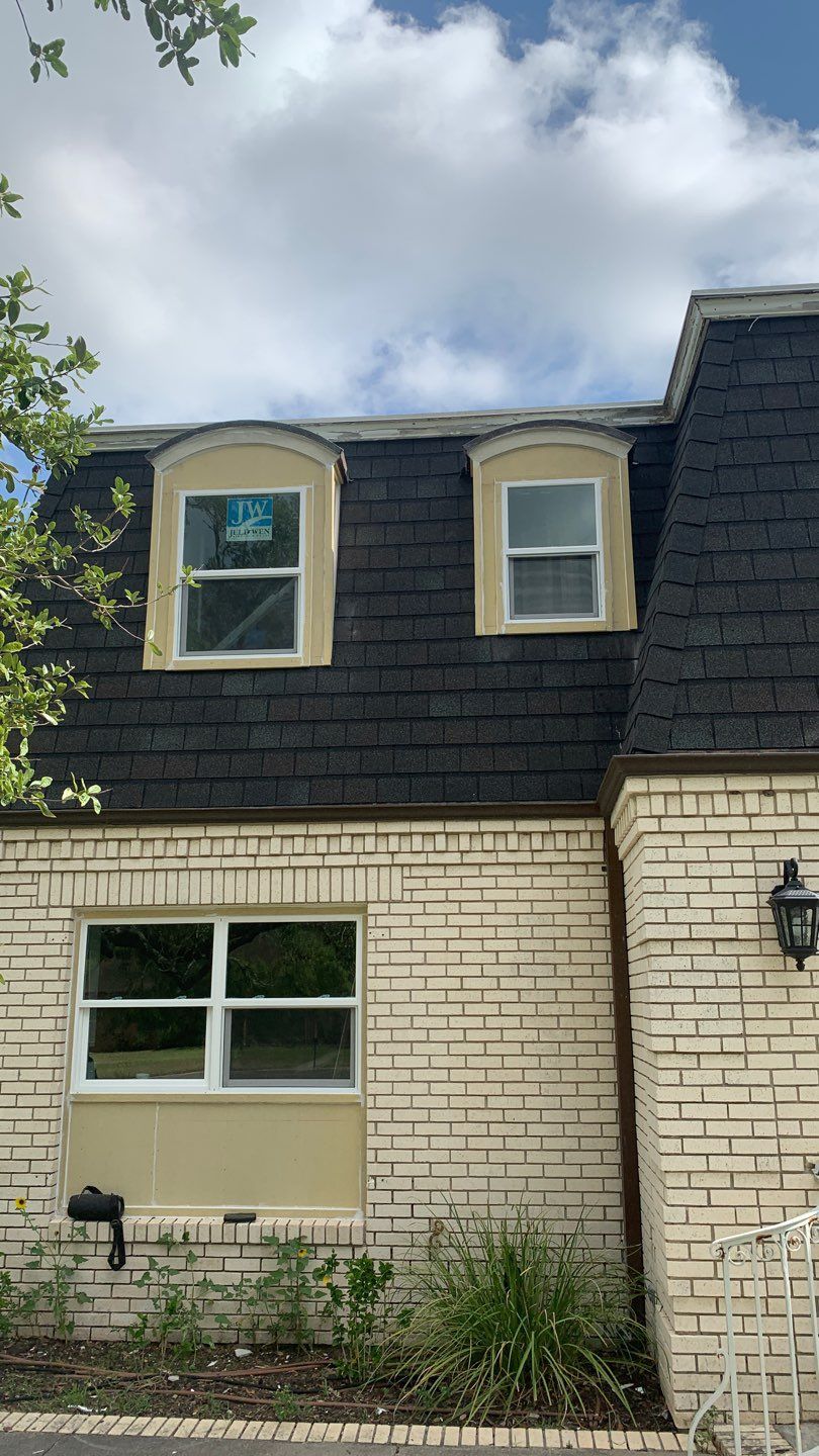Mansard Charm by Bayfront Roofing and Construction