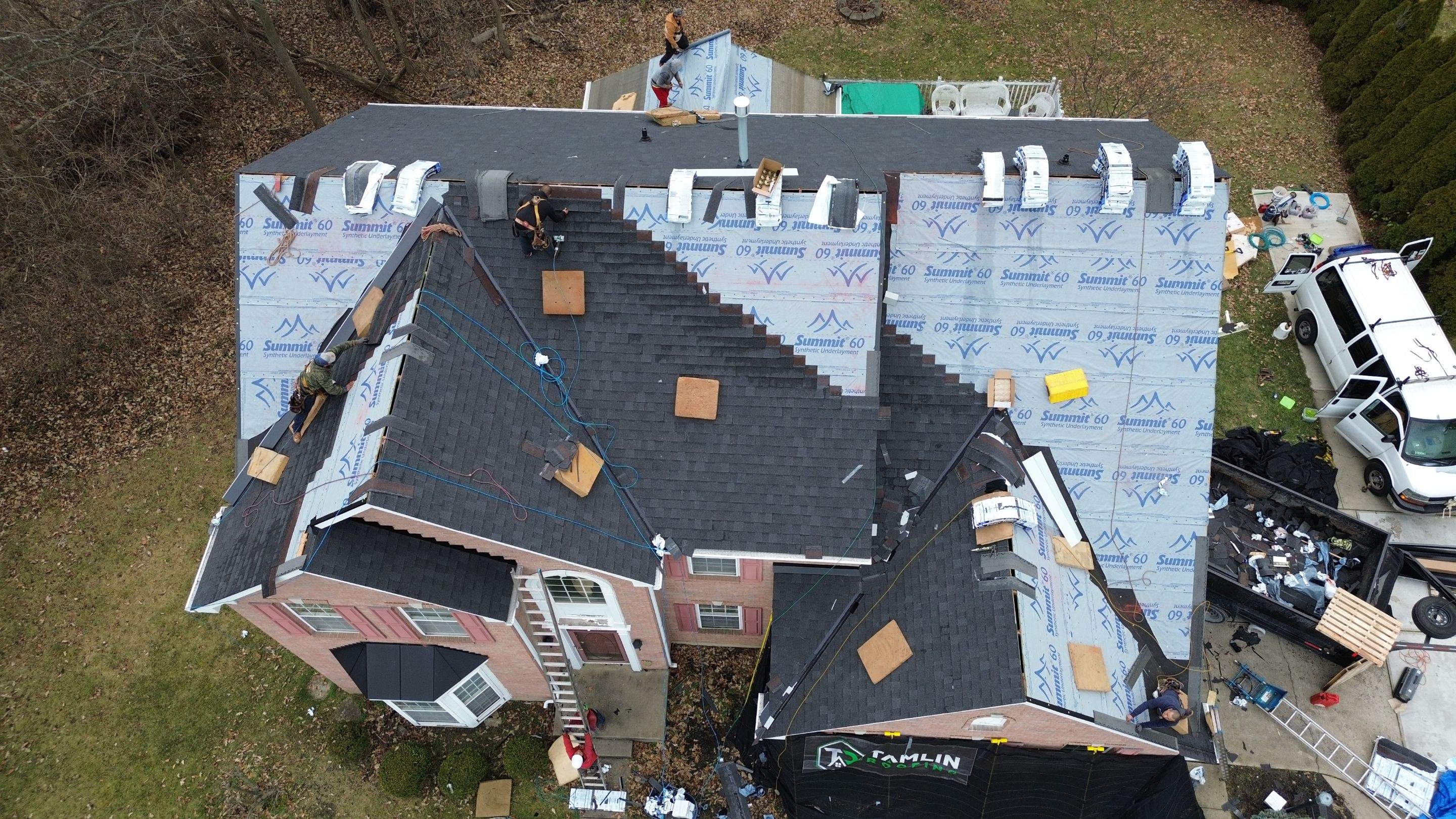 Walden Ponds - Pristine Black and Hydro Flo Gutter Guards by Tamlin Roofing