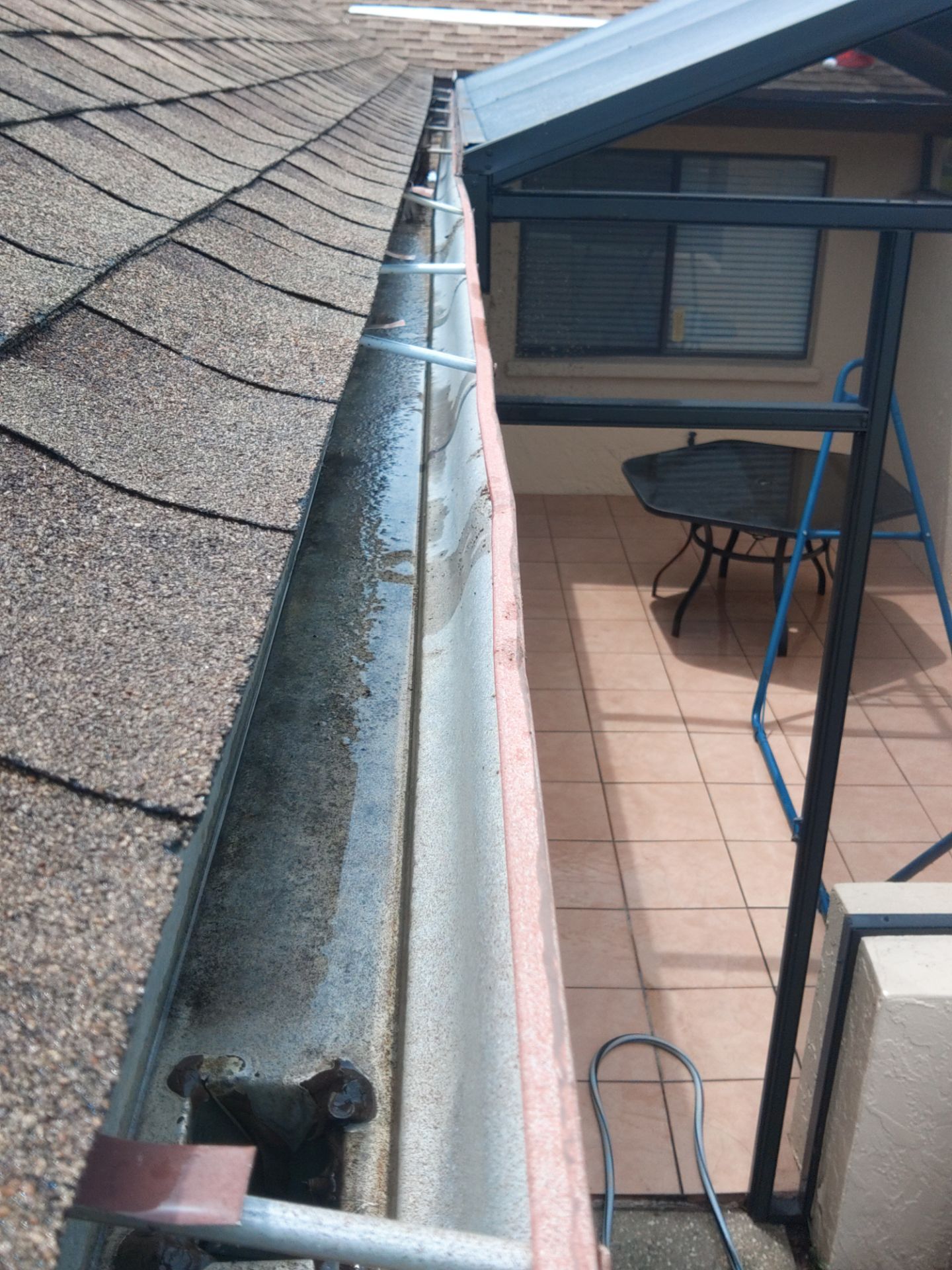 Gutter cleaning in Sarasota, FL is essential for keeping your drainage system working properly by Gutter Professors