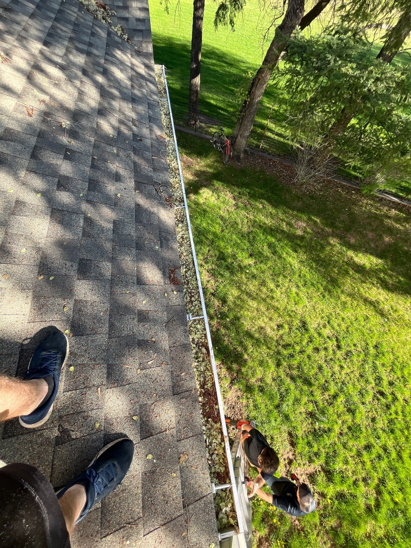 Commercial gutter cleaning Bozeman, MT before photo with filled gutters