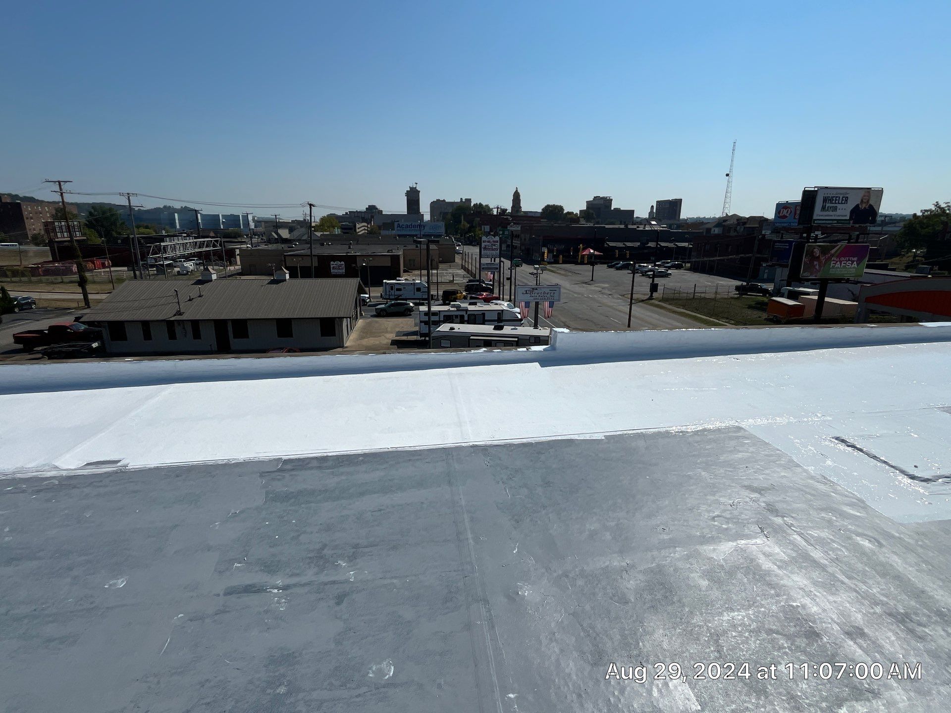 Commercial Roofing Installation using smartcoat Roof coating by Fahey Roofing + Contracting