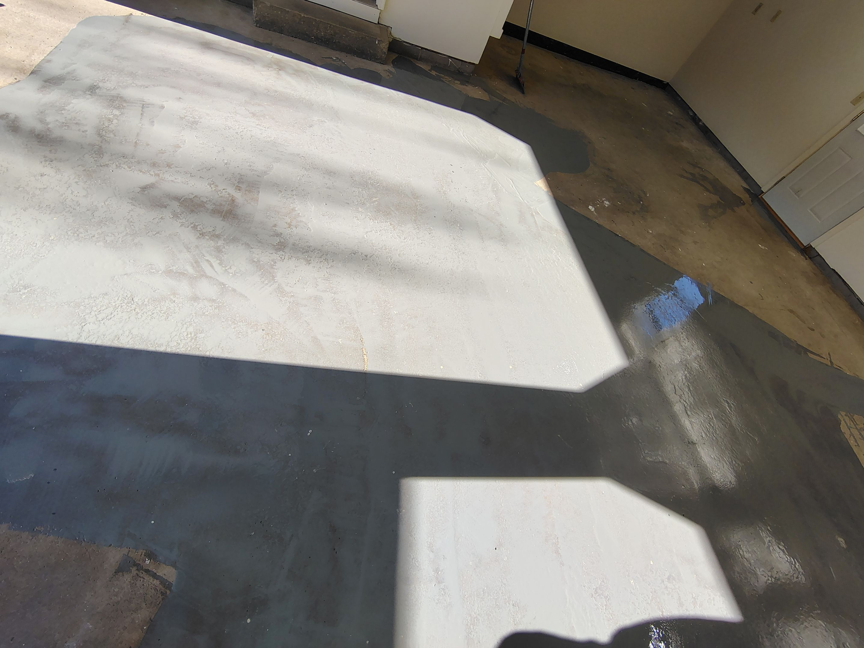 Full-Flake Epoxy Garage Floor Coating Installation in Sioux Falls by Select Painting, Coatings & Garage Cabinets