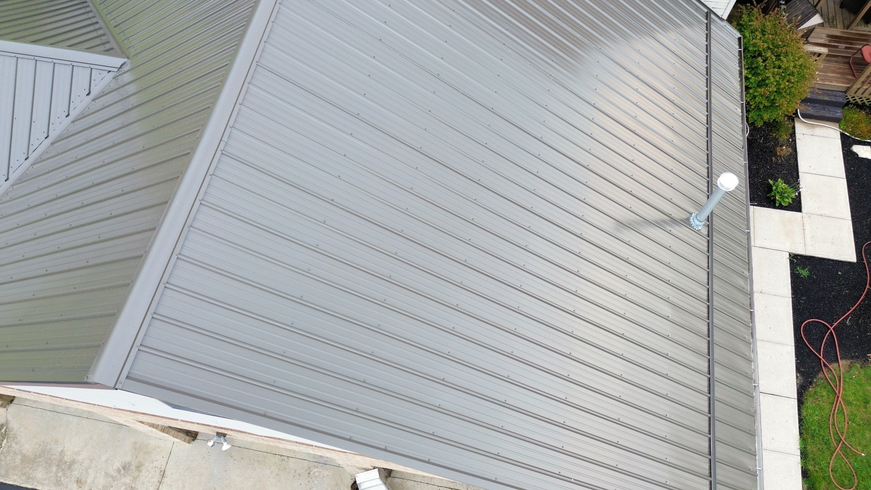 Residential Roofing Installation using Performance Panel Metal - Burnished Slate by RoofX 