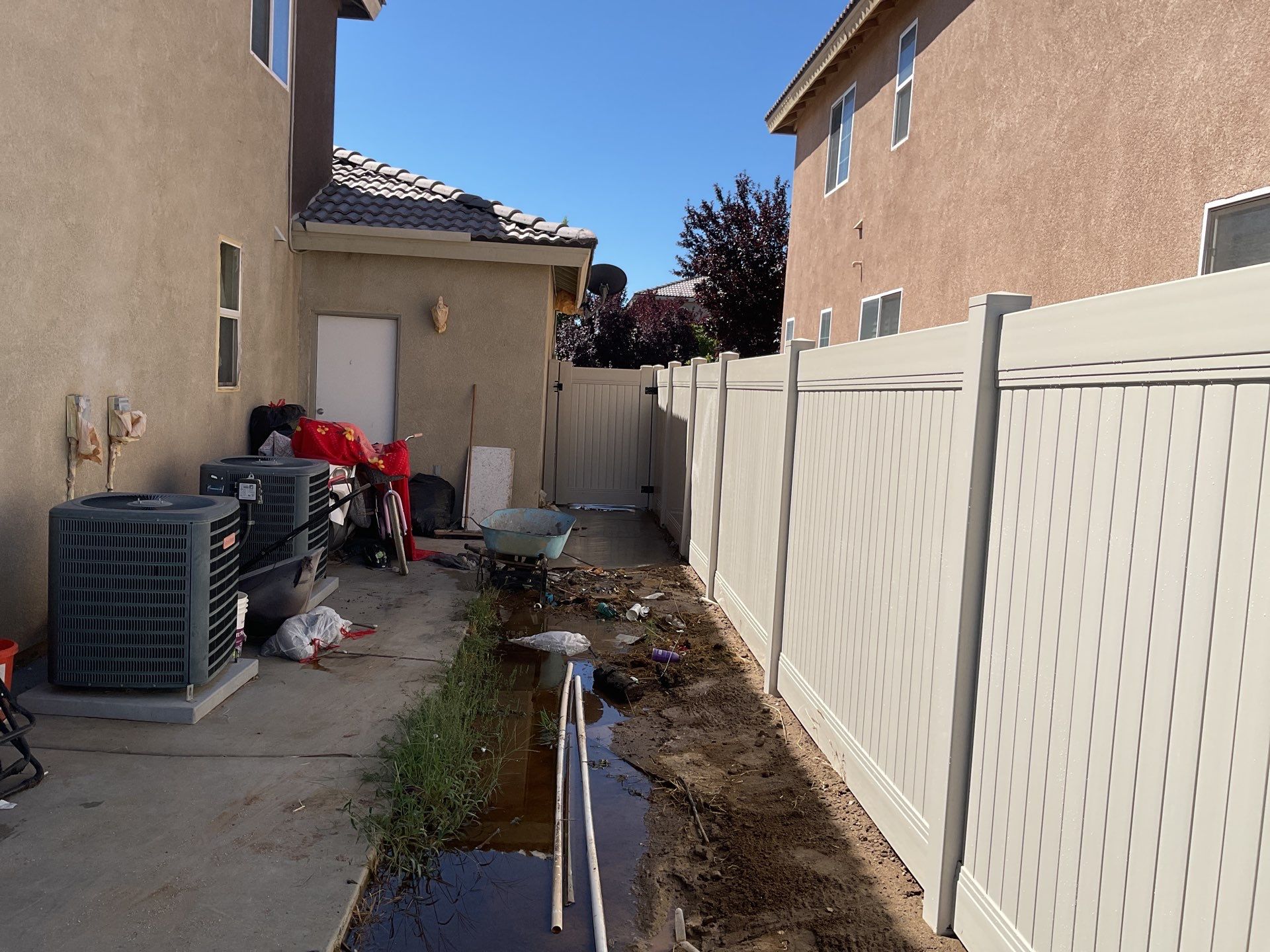 Tan Vinyl by Fence Guys Inc. 