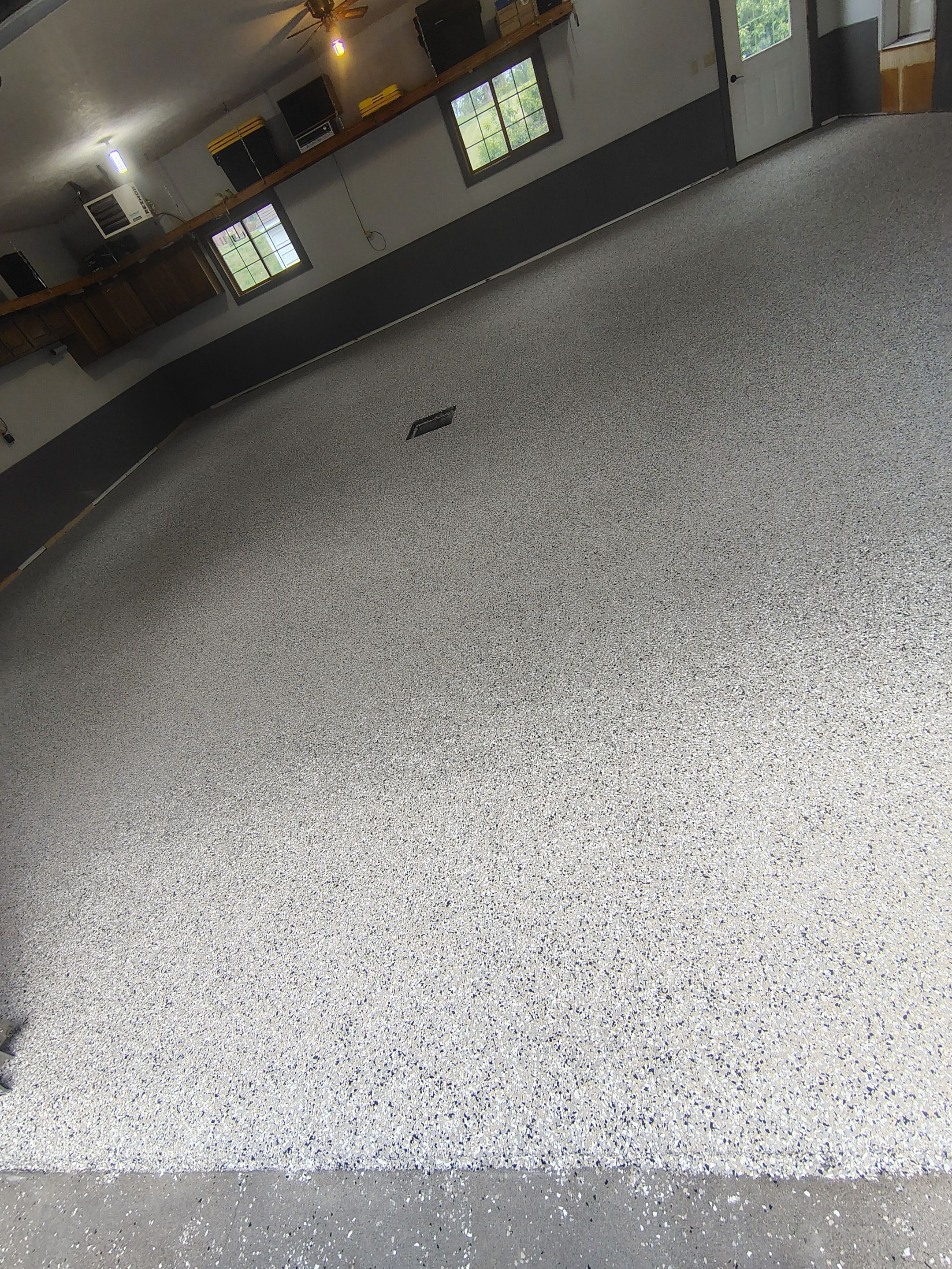 Multi-Fleck Epoxy Garage Floor Coating in Dell Rapids by Select Painting, Coatings & Garage Cabinets