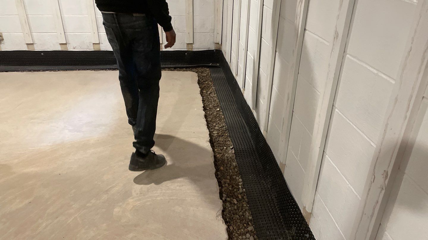 Interior Drain Tile & Buried Discharge in St. Anthony, MN by Waterproofing Northeast