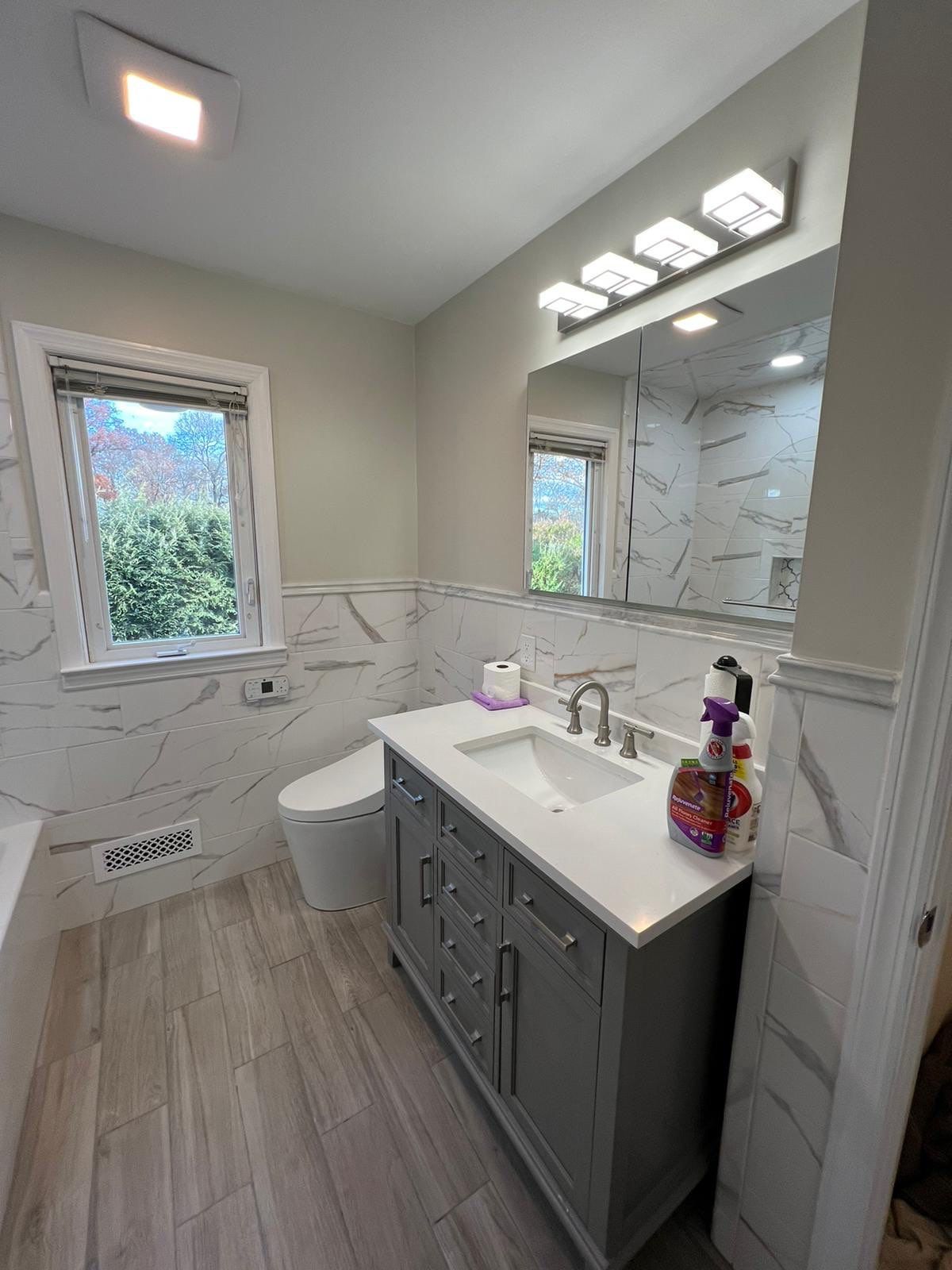 Bathroom Remodel using Tile by Home Concepts Construction