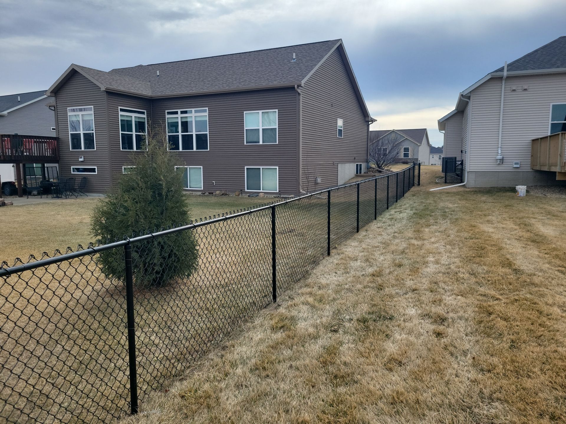 Black Chain Link Fence and Gate Installation in Cedar Falls by Perfect Picket Fence and Stain