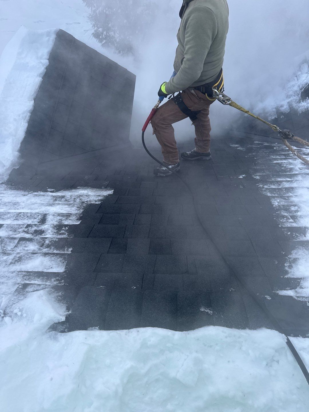 Roof Snow And Ice Dam Removal using Steamer by Total Restoration Services