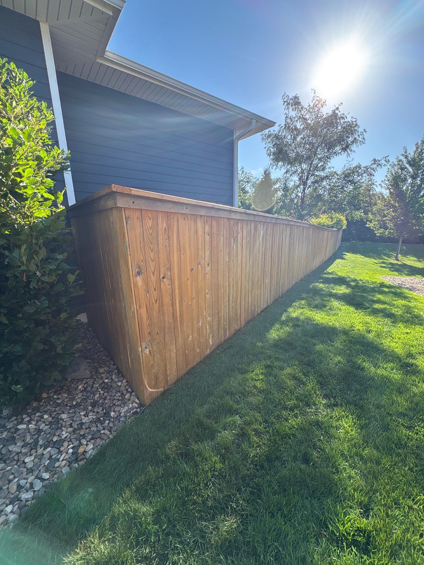 Custom Privacy Fence and Paver Patio Installation in Sioux Falls by Select Painting, Coatings & Garage Cabinets
