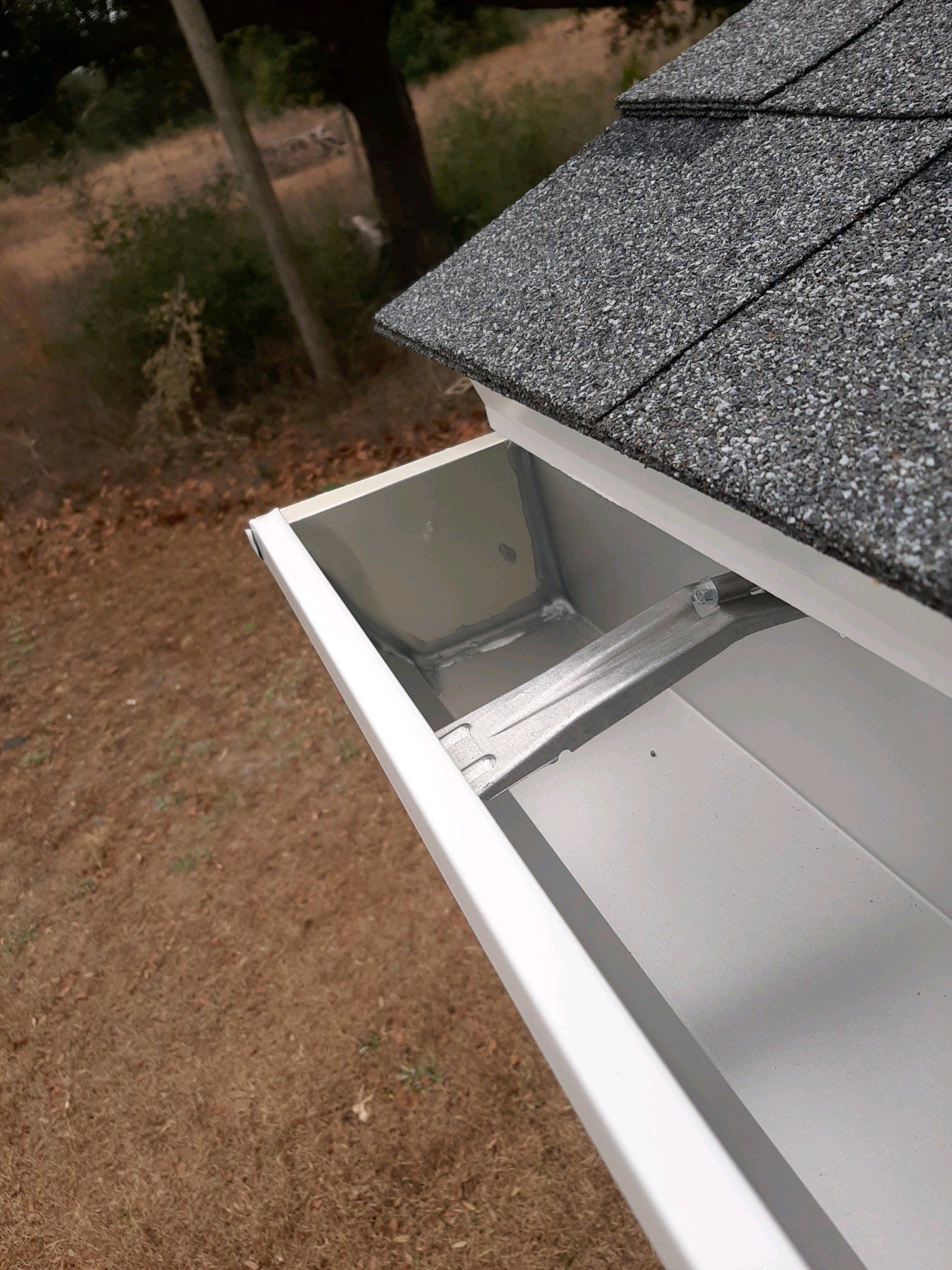 Gutter Installation using White Seamless Gutters by Gutter Professors