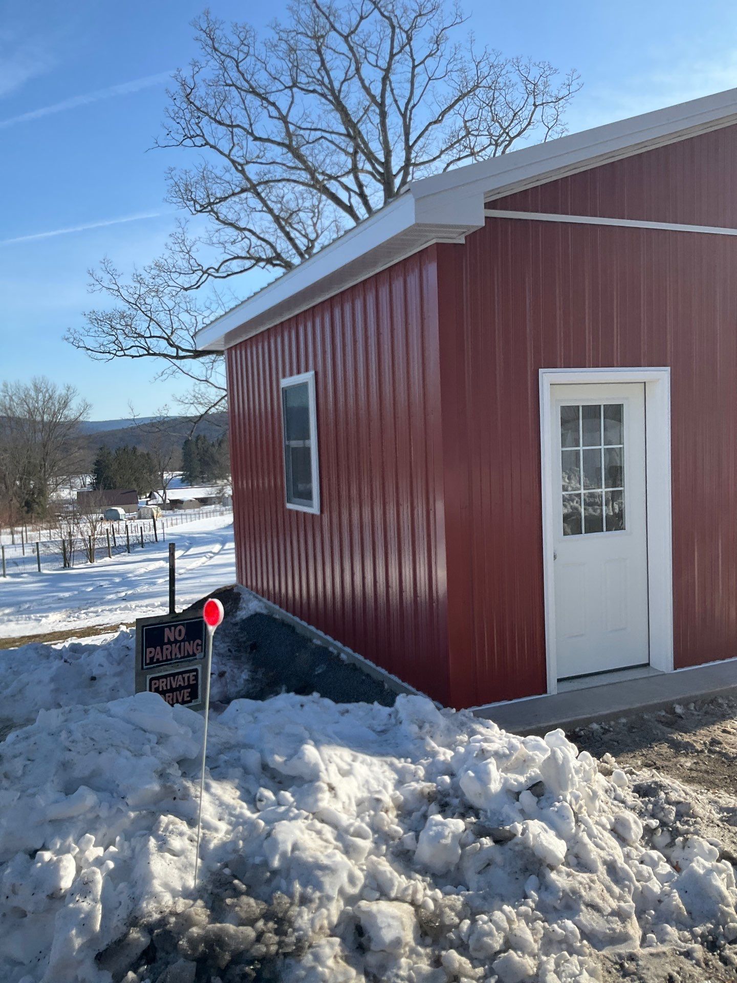 New Red Metal Garage Construction and Residential Window Replacement in Ashland by Esh Builders
