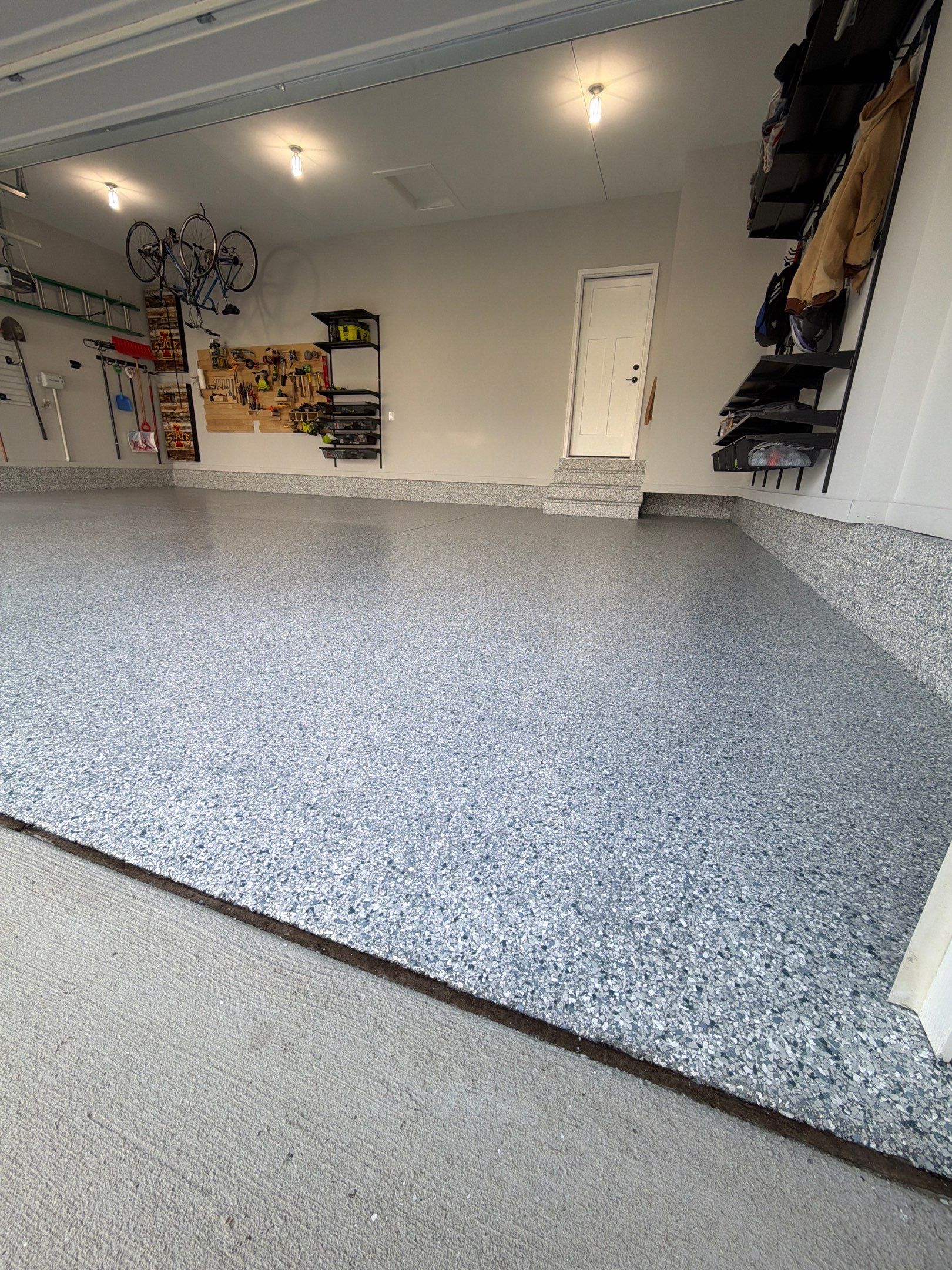 Waukee 3-Car Garage Transformation by Revival Concrete Coatings