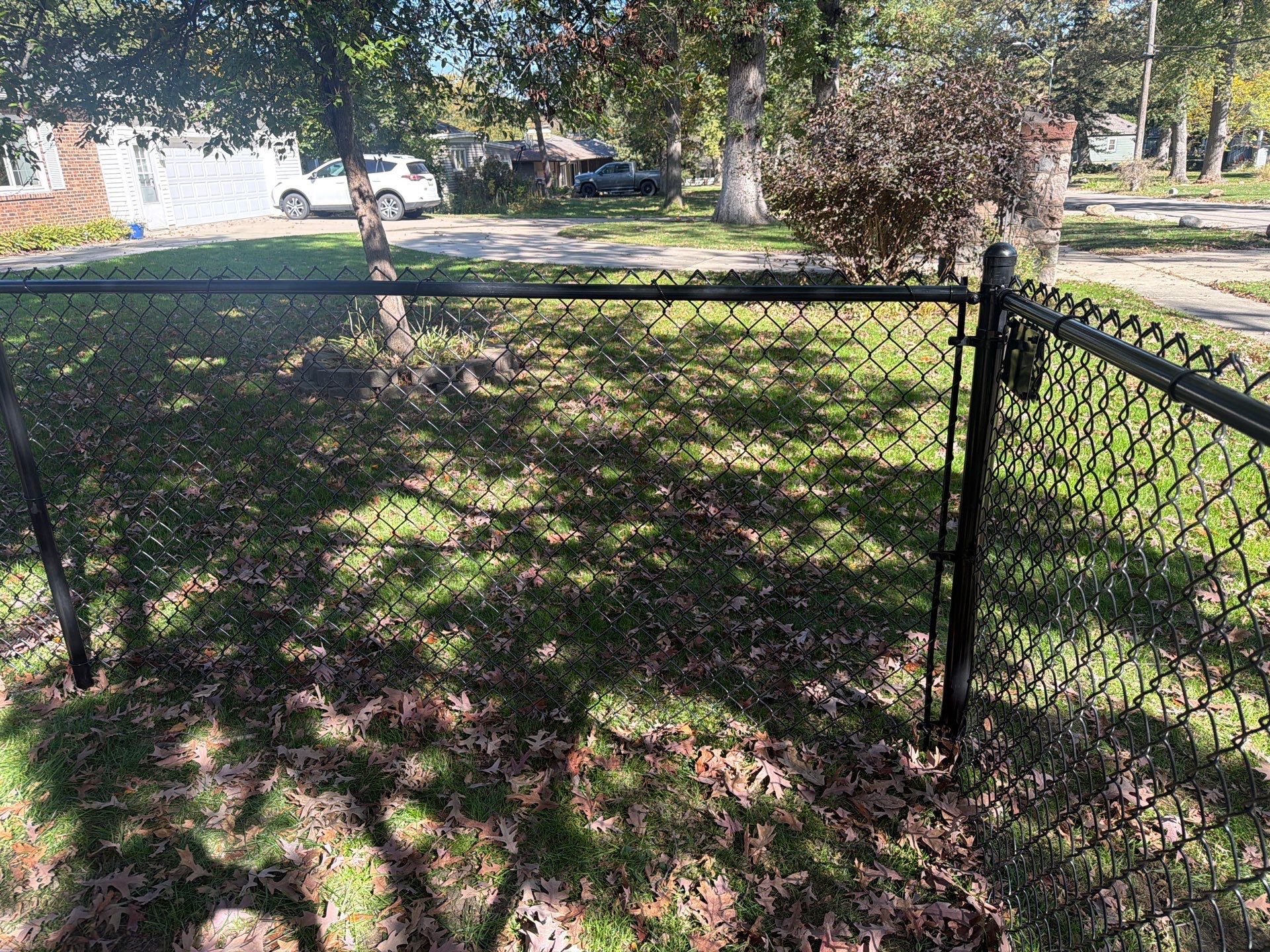 Residential Black Chain Link Fencing in Cedar Falls by Perfect Picket Fence and Stain