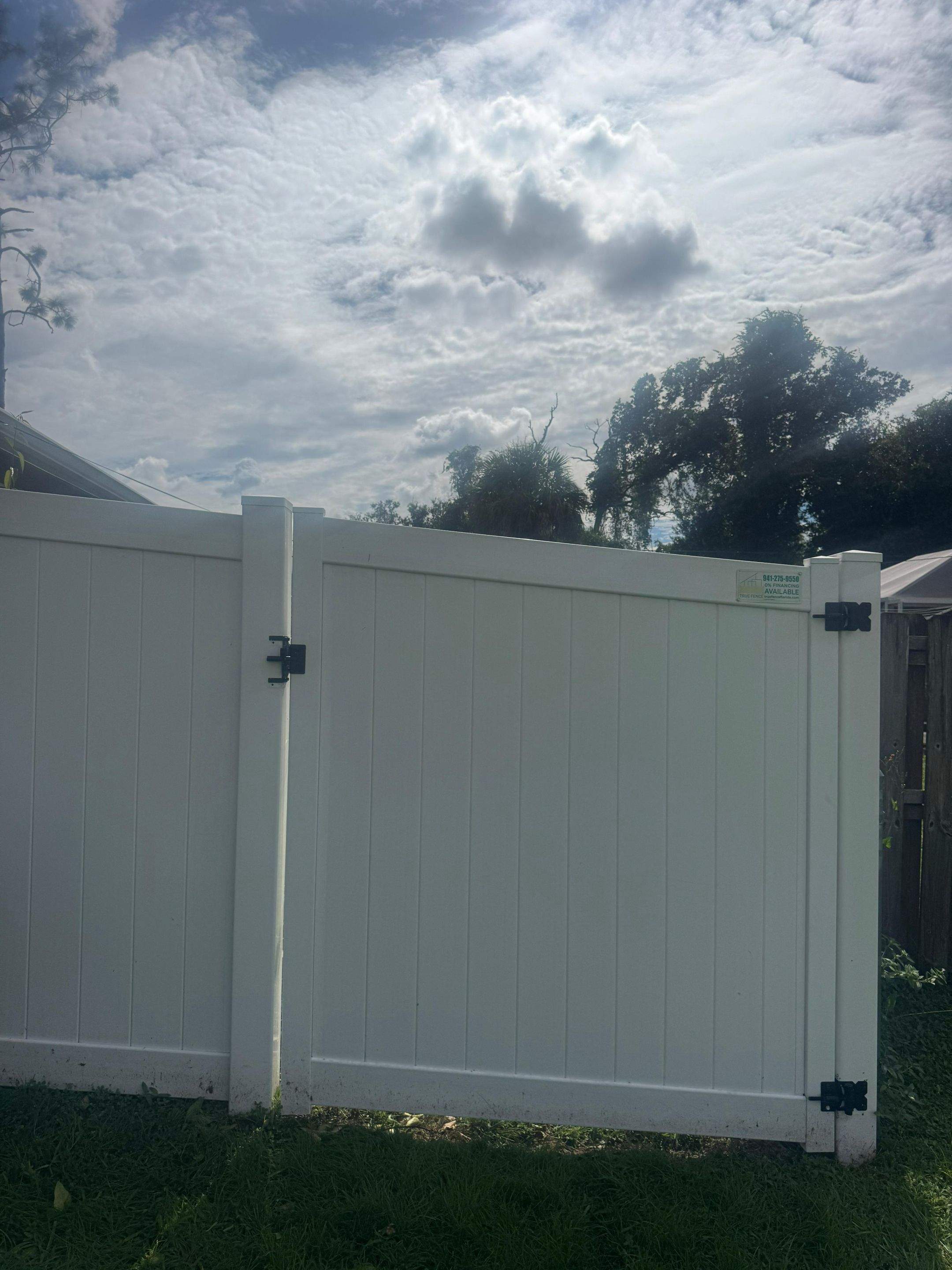 White Vinyl Privacy Fence and Gate Repair in North Port by True Fence LLC