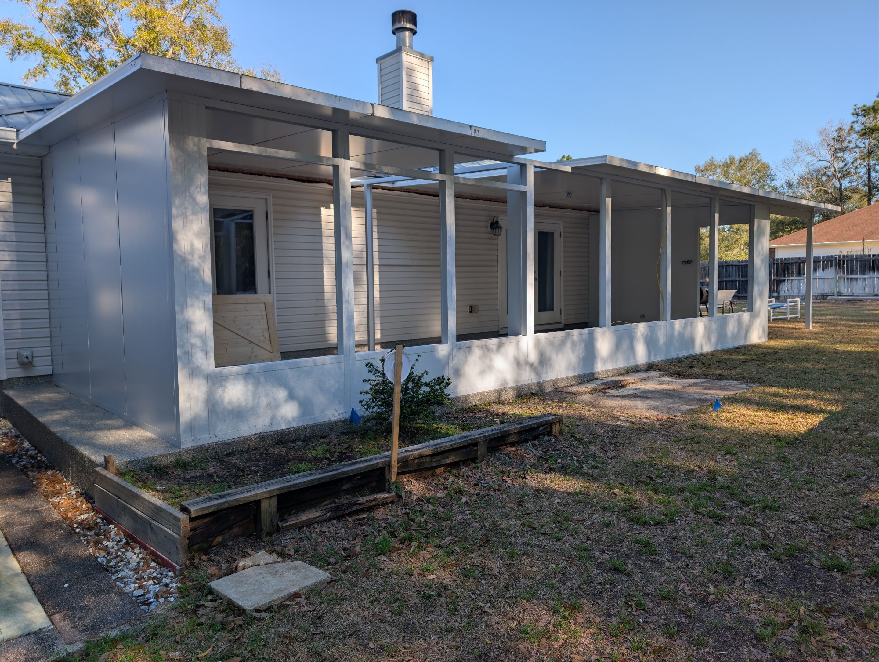 Large Divided Glass Room with Patio cover by Titan Sunrooms