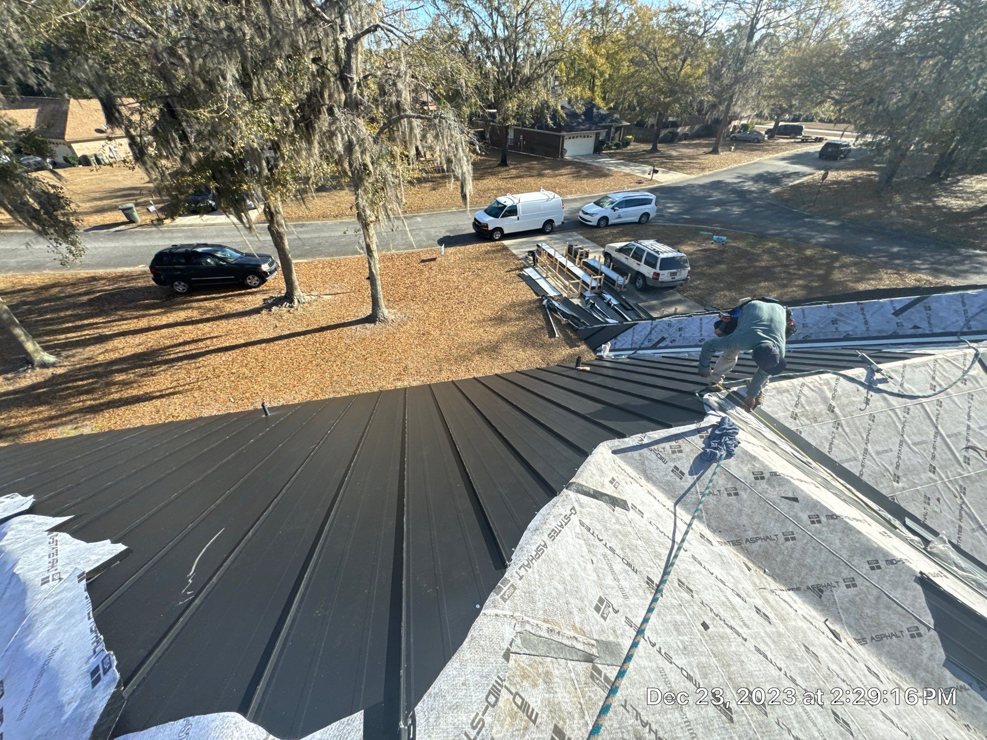 Residential Roofing Installation using Benton 26Ga 1inc Snapcock Metal Roof KYNAR Matte Black by Talya Roofing