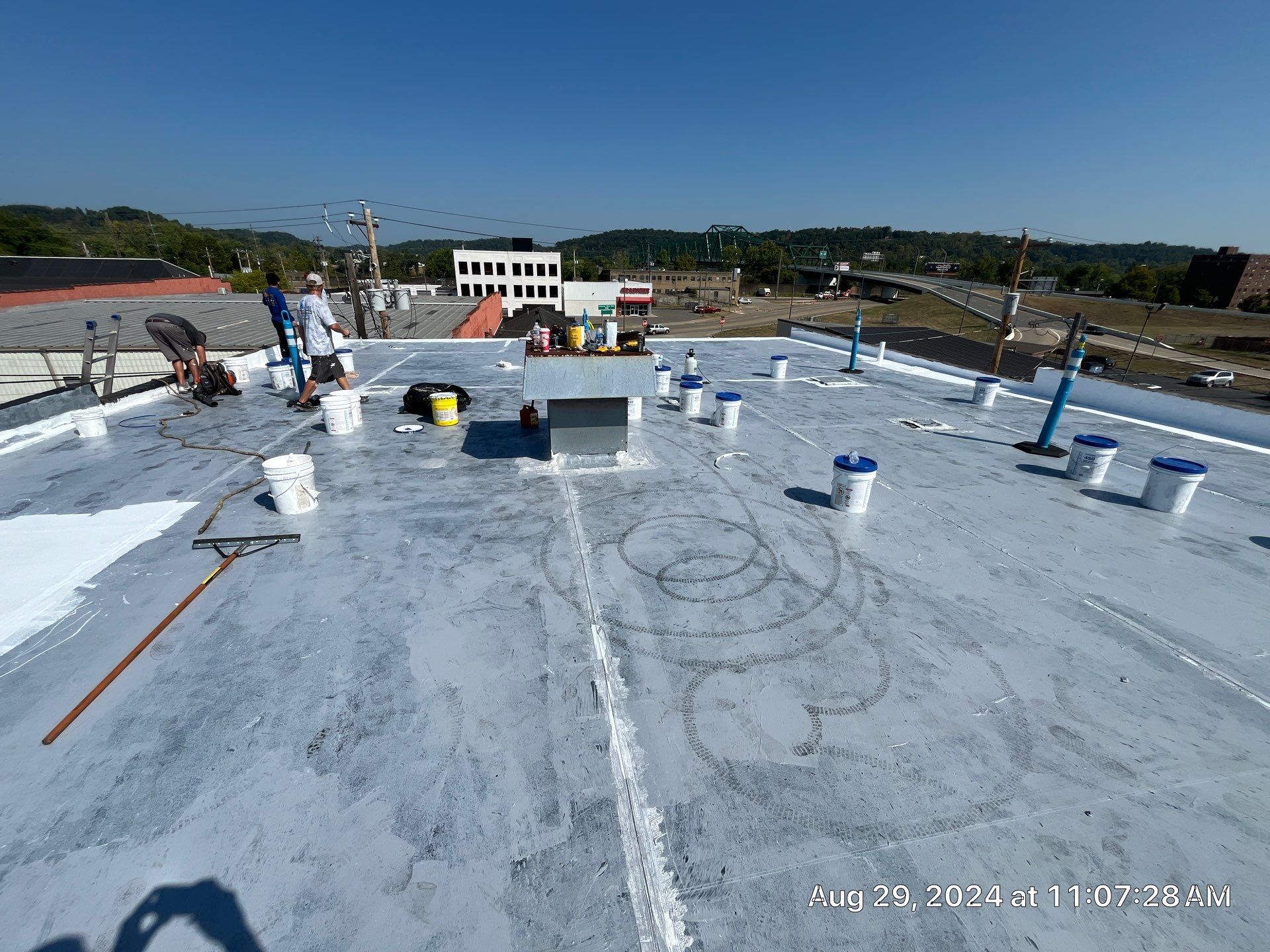 Commercial Roofing Installation using smartcoat Roof coating by Fahey Roofing + Contracting