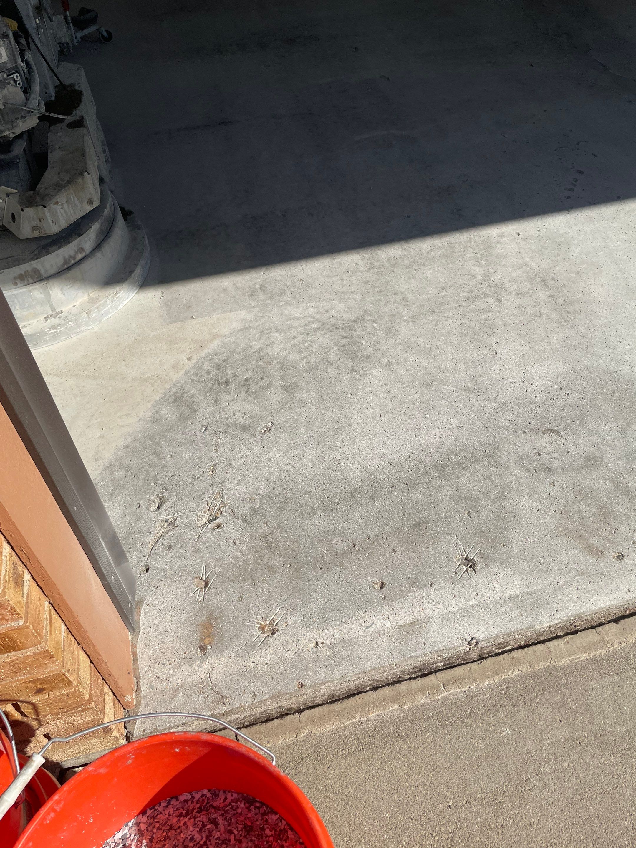 Grey Speckled Concrete Coating for Residential Garage in Yankton by Select Painting, Coatings & Garage Cabinets