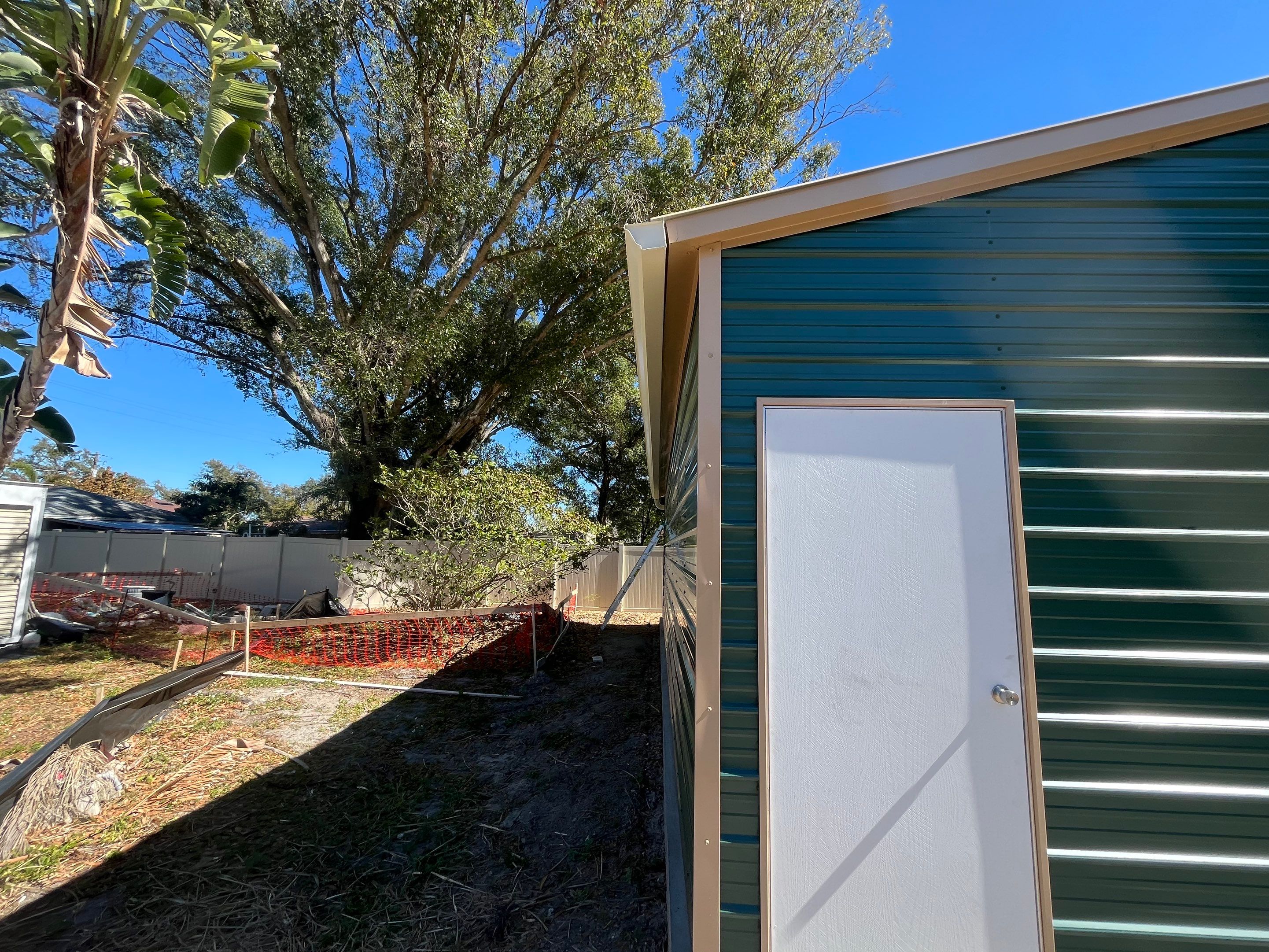 White 6-inch K-style Gutters and Down Spouts using Seamless Gutters White Down Spouts in Tampa FL by Gutter Professors