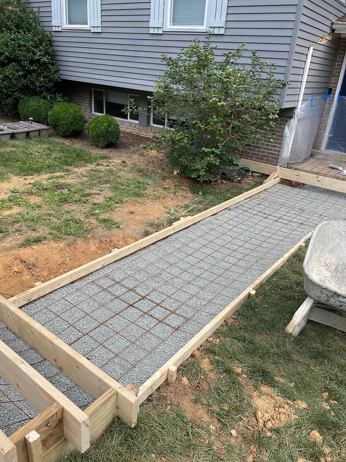 New walkway with stairs and a new front porch by Fairfax Contractors, LLC