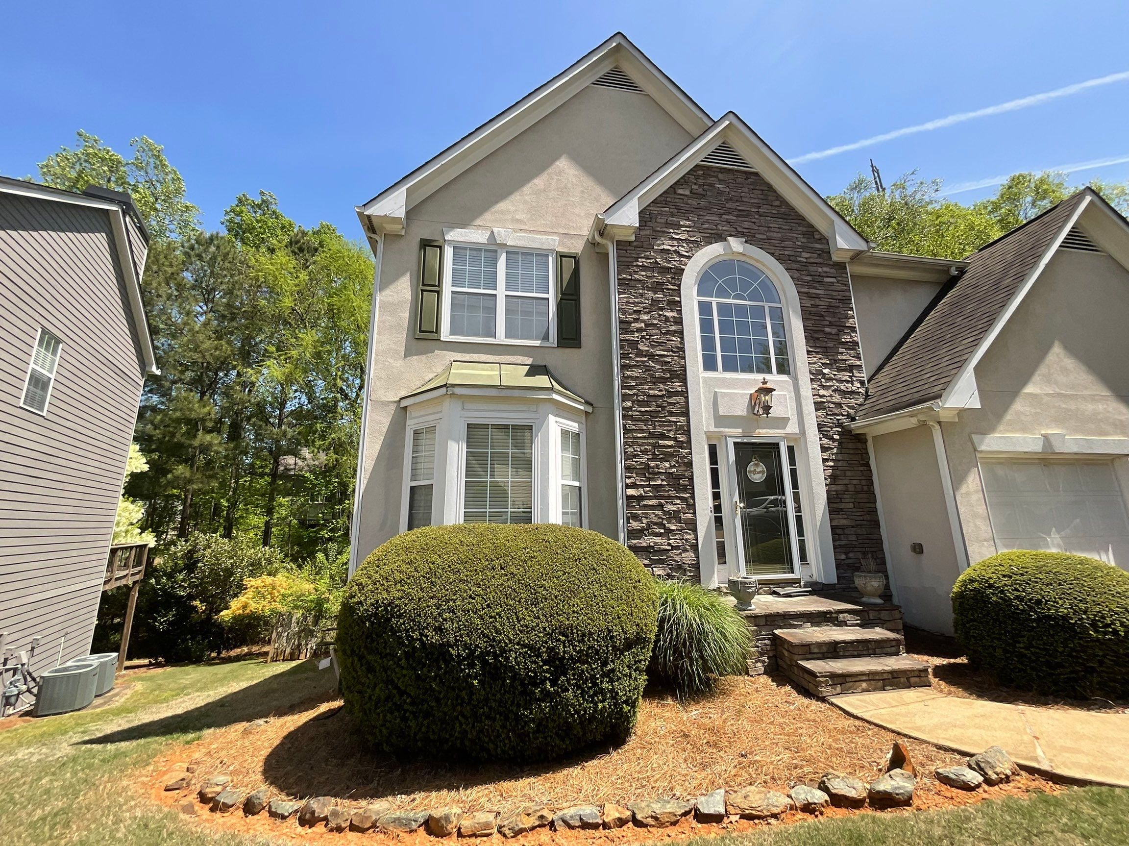 Stucco and Siding Exterior Painting with New Gutters in Kennesaw by Swift Home Renovations