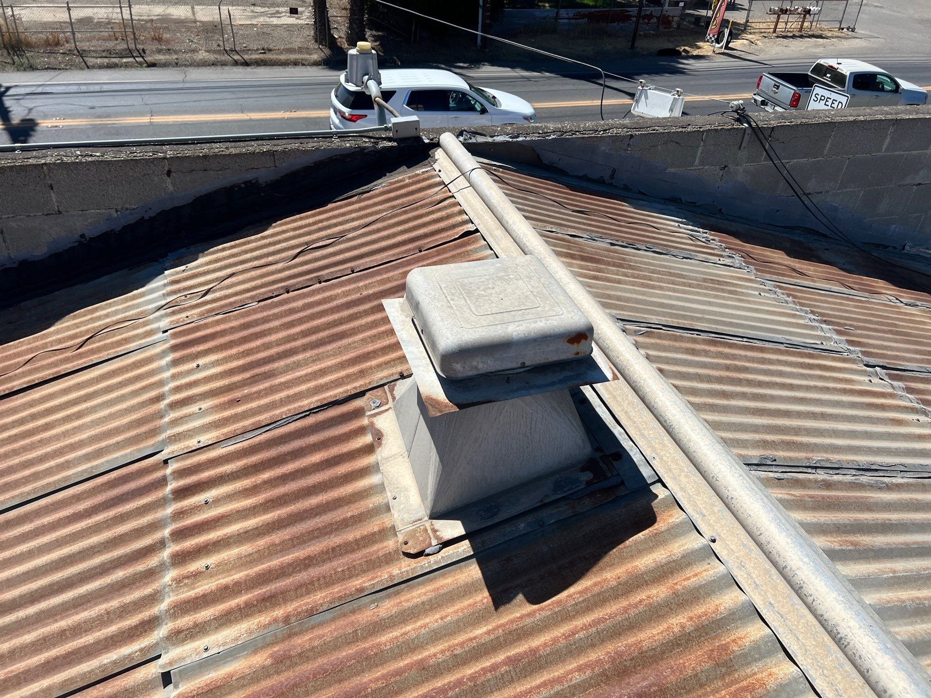 Spray foam and coatings using Conklin Benchmark/ PUMA XL acrylic coatings over metal and foam by Straight Edge Roofing Inc