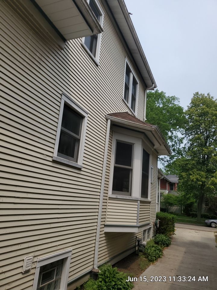Housewashing  using Algaecide, soft wash soap by Northern Power Washing LLC.