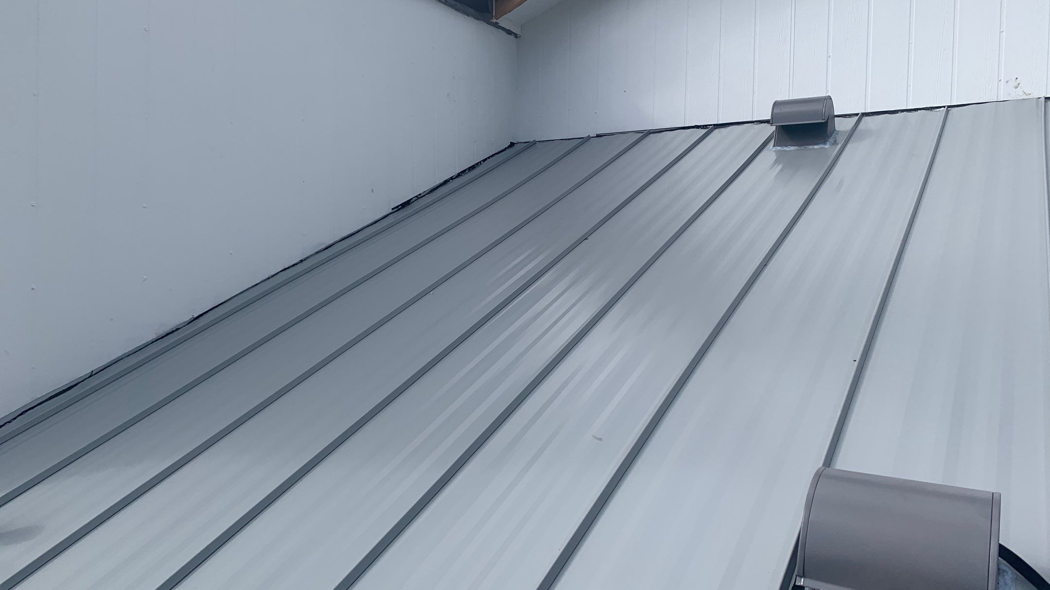 Residential Roofing Installation using 1" Nail strip metal roof by BLUES BROTHERS CONSTRUCTION CORP