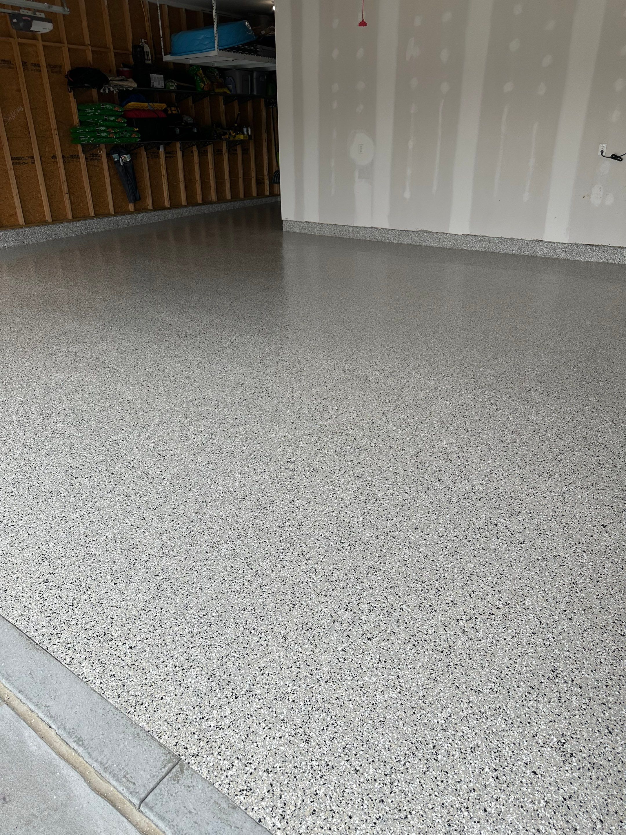 Three-Stall Garage Epoxy Floor Coating Installation in Lincoln by Goat Coatings