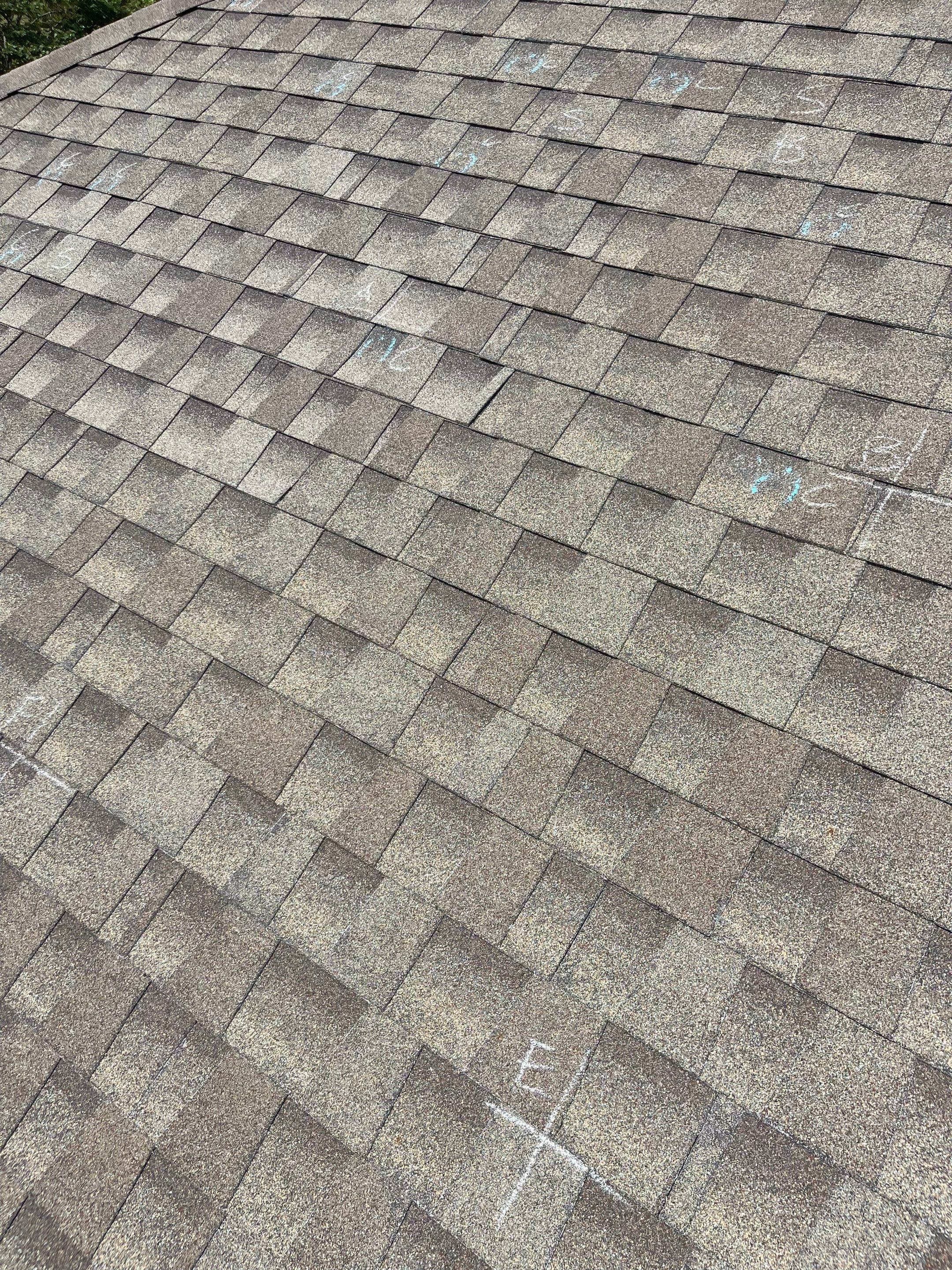 Hail Damage on a Roofing System by Icon Roofing And Construction 
