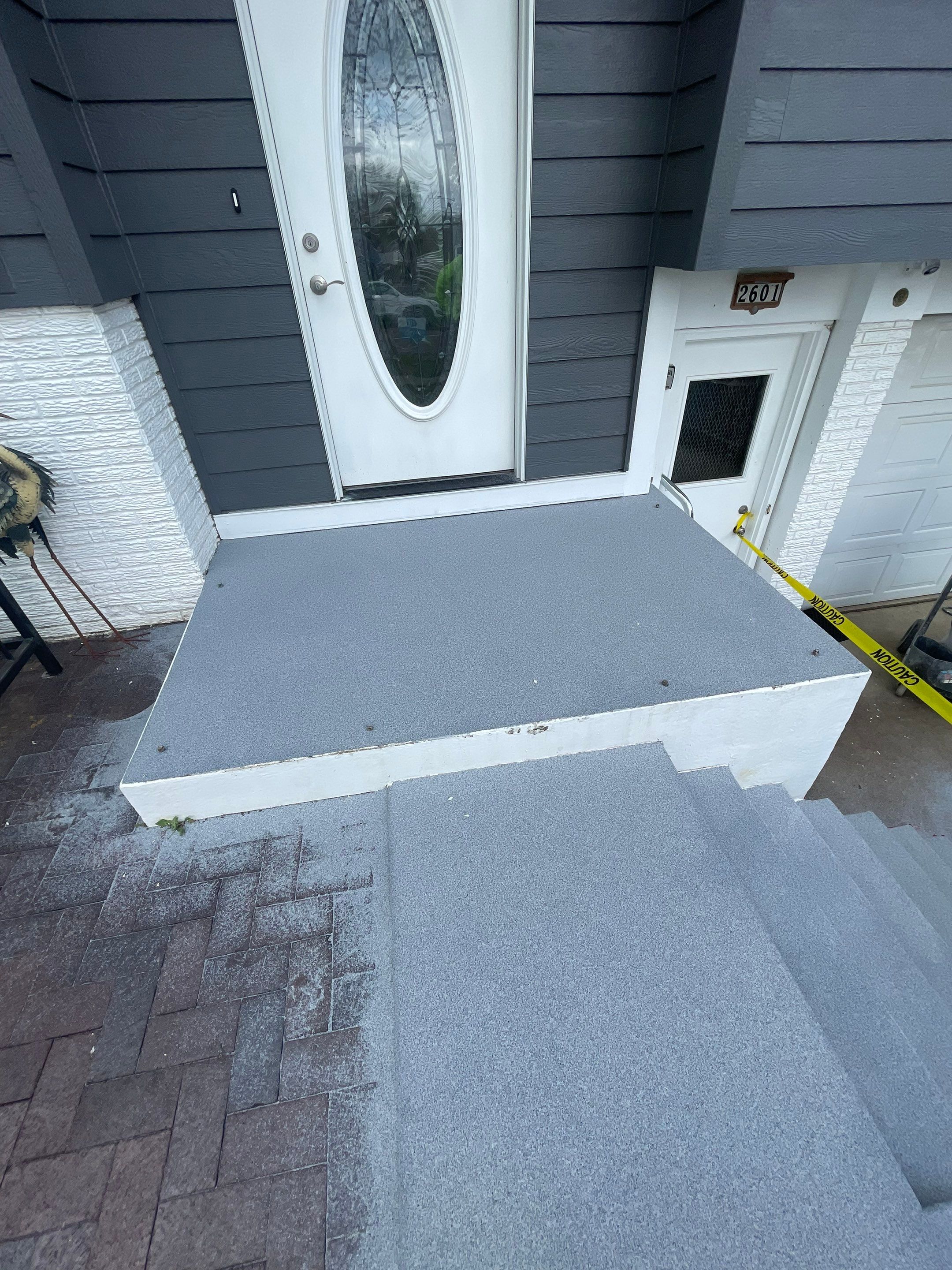Grey Polyaspartic Porch and Stair Resurfacing in Sioux Falls by Select Painting, Coatings & Garage Cabinets
