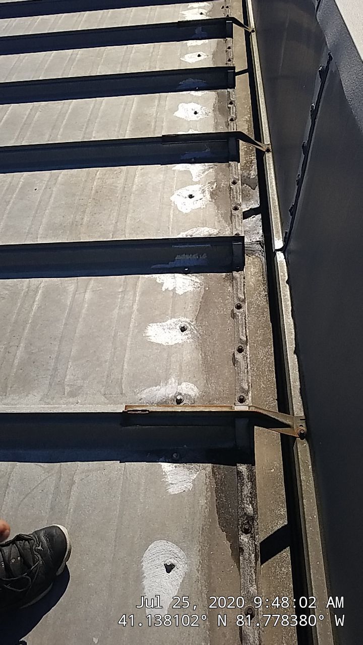 Commercial Metal Roof Coating by Gold Star Roofing LLC